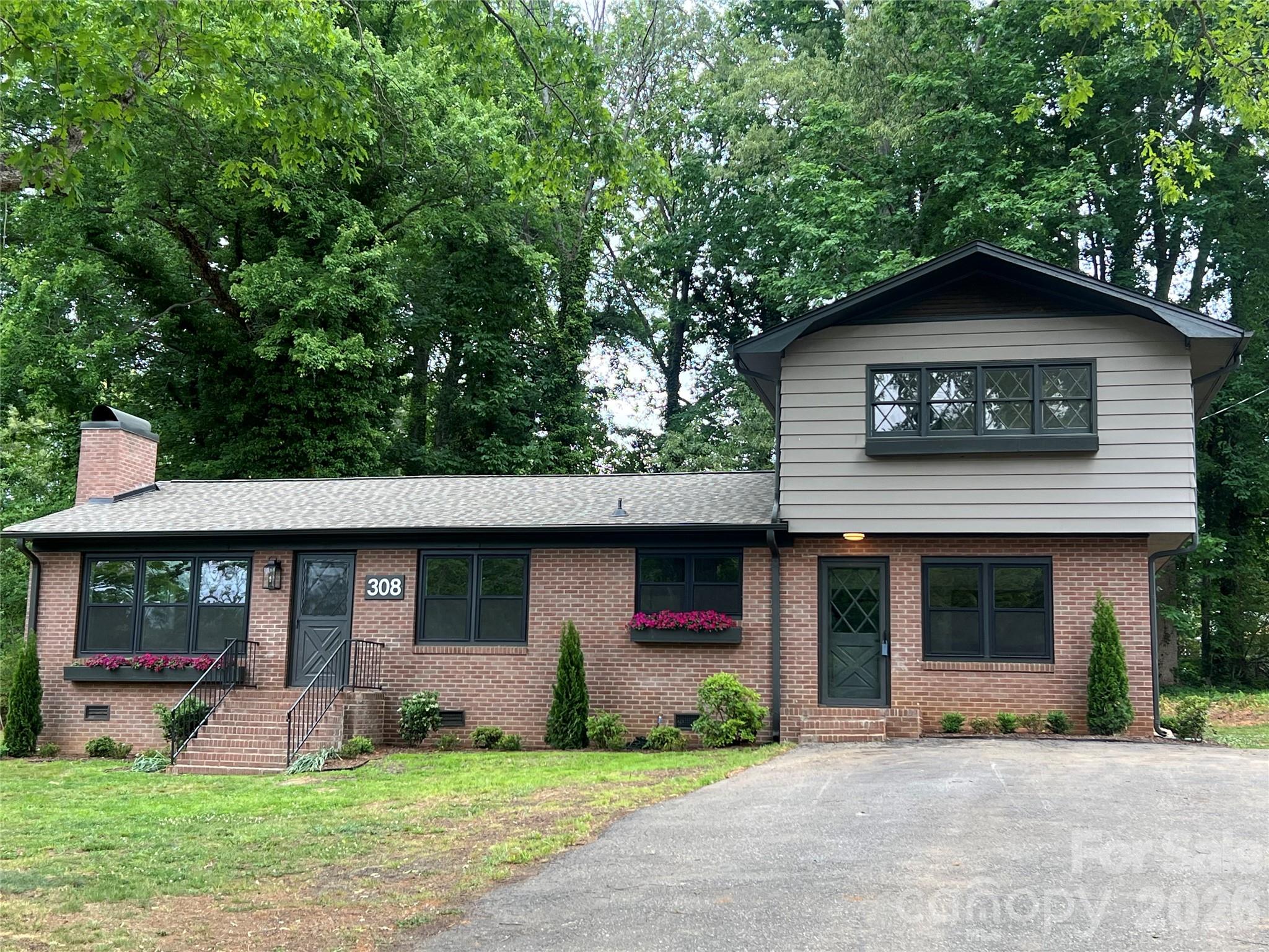 Welcome home to the perfect blend of modern convenience and good-old-days charm. Tucked away on a quiet dead-end street, this beautifully updated 4-bedroom, 2.5-bath home offers space, function, character, and a location that is hard to beat — less than five minutes to I-85, restaurants, shopping, George Poston Park, walking trails, and access to the Carolina Thread Trail. Inside, you’ll love the gorgeous renovated kitchen featuring an island, all-new appliances, abundant storage, and thoughtful designer touches throughout. The home also offers all-new LVP flooring, updated bathrooms, a custom primary closet, beautiful fixture selections, and generous storage. The sellers thoughtfully preserved the unique gingerbread windows, adding a special touch of character that makes this home feel truly one of a kind. With a spacious living room, wood-burning fireplaces, and a large peaceful backyard, this home invites you to slow down and enjoy life — game nights by the fire, bikes on the dead-end street, and time spent outside with the people you love. Recent improvements include a new HVAC system, water heater, majority of windows replaced, and newly completed landscaping. A storage shed adds extra functionality out back. Best of all, all work was permitted and completed by licensed professionals. This home delivers the best of both worlds: modern updates, everyday convenience, and a nostalgic sense of home.