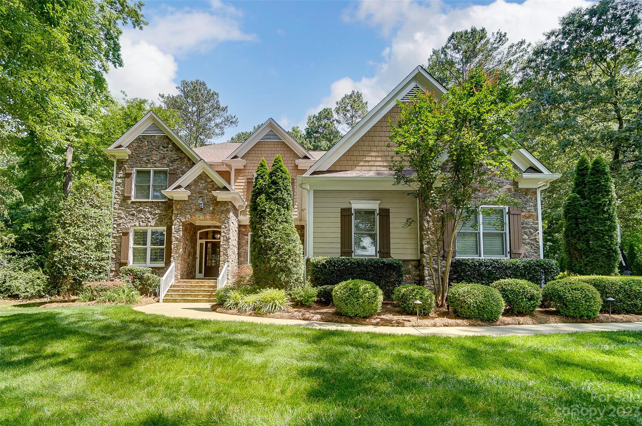 Beautiful custom home sits across from Lake Wylie in lovely waterfront community Heron Cove. Nice amenities include pool, playground, walking trails, lake access for canoes & kayaks. Level, one acre lot. Very private & backs up to common area. Large main level primary suite, formal dining & office, custom site finished hardwoods, NO carpet. Spacious kitchen w/ huge island bar, granite, gas cooktop, & lovely upscale glazed maple cabinets. 2-story great room opens to screened porch & large patio. Very expensive stairway chairlift, owner will leave OR will remove for buyer & repair stairs. Owner's updates include new hardwood floors in BRs & upstairs living room, natural gas to laundry, Ecobee Smart Thermostats, Schlage Smart Locks, Encapsulated crawl space, Air scrubbers on up & down HVAC,  New downstairs HVAC, New upstairs furnace, New outdoor pavilion, firepit, exterior lighting, & irrigation system. Fantastic location, highly rated Clover school district. Low SC taxes! Must see!