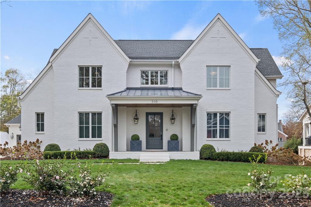 Absolutely gorgeous E S Johnson custom built luxury home on .50 acre lot in Davidson's most sought after downtown location. The 5 bedroom, 4.5 bath home with professionally landscaped yard, immaculate trim & finishes, hardwood floors, an elevator serving the 3 floors and other features too numerous to mention here ( PLEASE REFER TO MLS ATTACHMENT " 310 WALNUT FEATURES"). Finished basement has a den opening to a covered patio, a large office with multi-purpose area for media or game tables, bedroom and full bath, an exercise room with closet (can also be a 6th bedroom), and a large storage area. Throughout the home you will find numerous windows which brighten all living spaces.