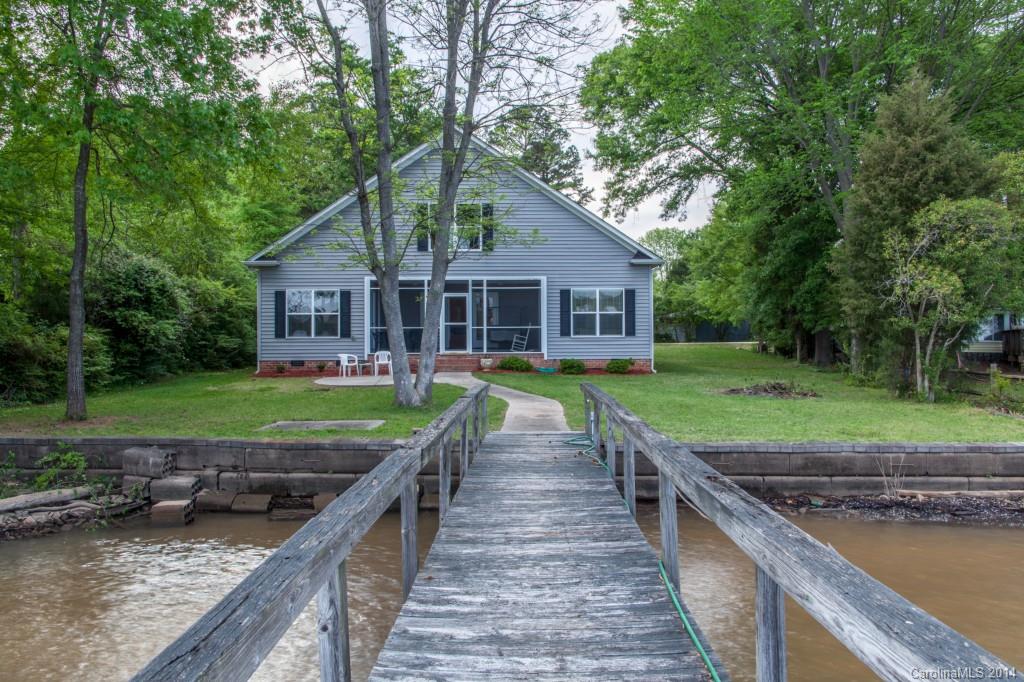 Immaculate and better than new! Adorable 3 bedroom, 2 full bath, one half bath home ready for you to move in and enjoy the Lake!! This home has potential for additional room that can be finished in the attic. Seller custom built this home with the expansion possibility upstairs in the attic. Dock with boat lift!!  Great location and easy commute to Charlotte, Rock Hill and Airport. Clover Schools, Low County taxes!!