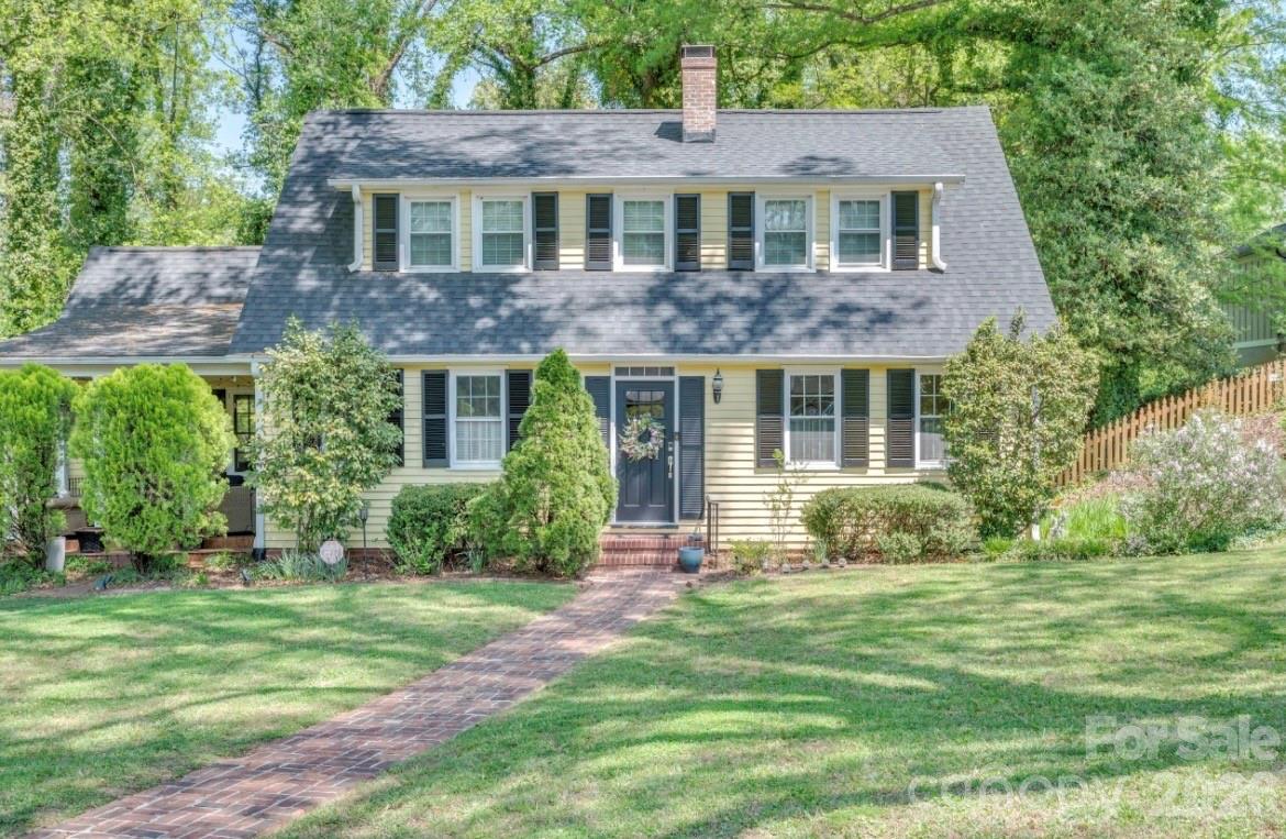 Cape Cod Home with Southern Charm! Doll house curb appeal!  Quite street in well established desirable neighborhood. Home boasts updated eat in kitchen with coffee bar space. Cozy Study/Den leads out to the inviting "sweet tea sipping" covered porch.  Snuggle up by the gas fireplace in the living when it's chilly out. Formal dining for when they all come to visit. Main level bedroom and bath. Large family space in the basement with 2nd kitchen and bath. Perfect great room or play area. Fenced back yard. Perfect location for the simple life. Walk to Downtown Morganton. Close to I-40 and Hospitals. Morganton is located conveniently between Asheville and Charlotte.This home is oozing with welcomeness, a must see!