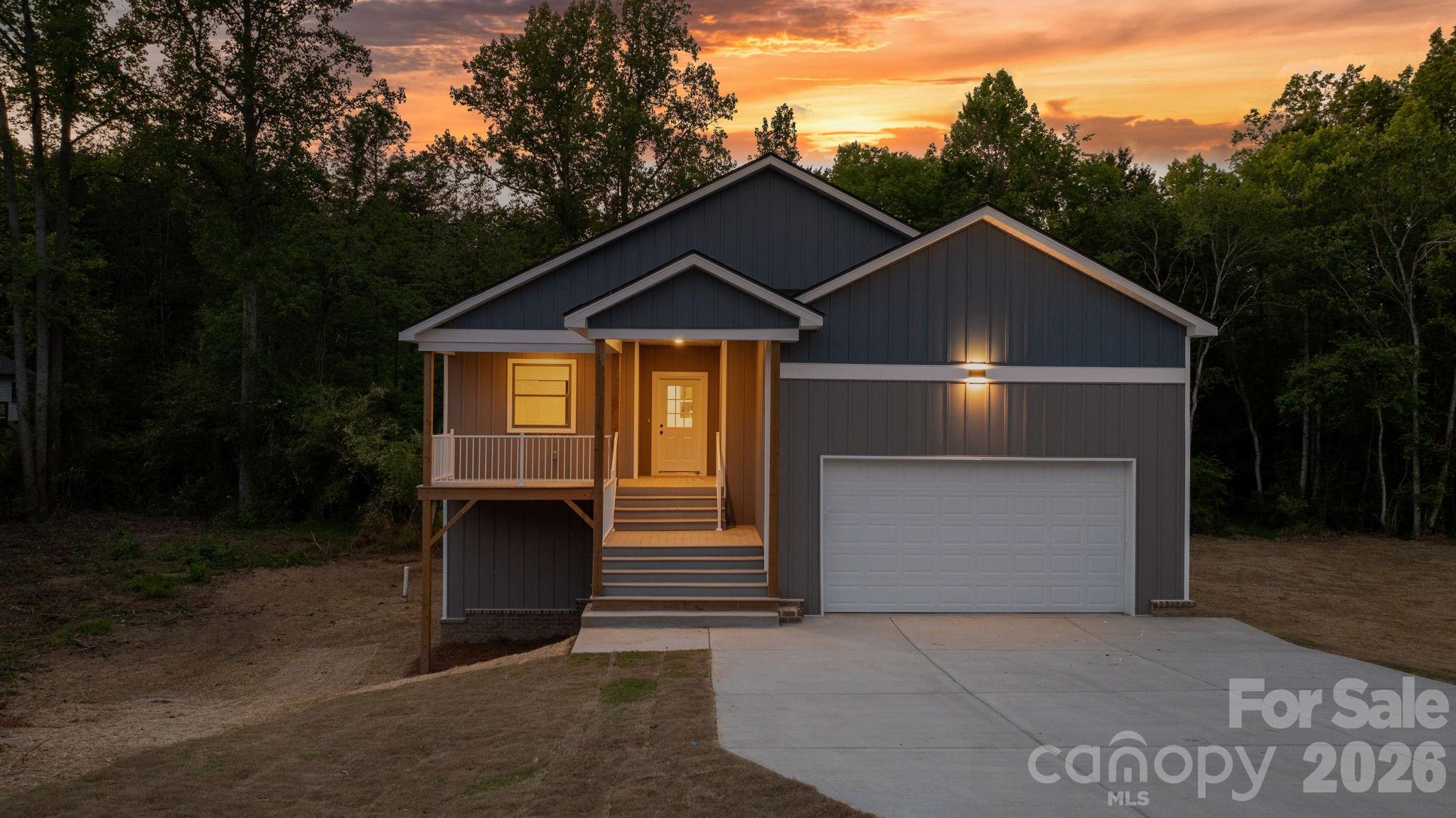 Welcome to this beautifully crafted 4-bedroom, 3-bath home built by Catana Homes, offering 2,128 square feet on a half-acre lot tucked into a cup-de-sac in the desirable Wittenburg Springs community near lake Hickory! Just 5 minutes from the Hickory city limits and 15 minutes to downtown Hickory, this location offers the quiet of a slightly-outside-the-city setting with everyday conveniences close at hand and no city taxes.
Inside, modern finishes and quartz countertops set the tone throughout an easy-to-live-in floor plan. Enjoy seamless indoor-outdoor living with a back deck off the main level,  perfect for morning coffee or evening gatherings. The walk-out basement is a true standout, featuring a full bedroom with closet, a full bathroom, and a back patio that opens directly to the yard. Additional unfinished space is ready to be customized into a media room, home gym, second living area, or in-law suite.
A 2-car garage, city water and sewer, and a generous backyard with plenty of room to fence in for your furry companions round out the everyday livability. Outdoor enthusiasts will love being less than 10 minutes from the Wittenburg Springs Boating Access on Lake Hickory.
4 bedroom, 3 bathroom Offered under $500,000 is rare! Private showings available next week reach out today to secure your appointment.
