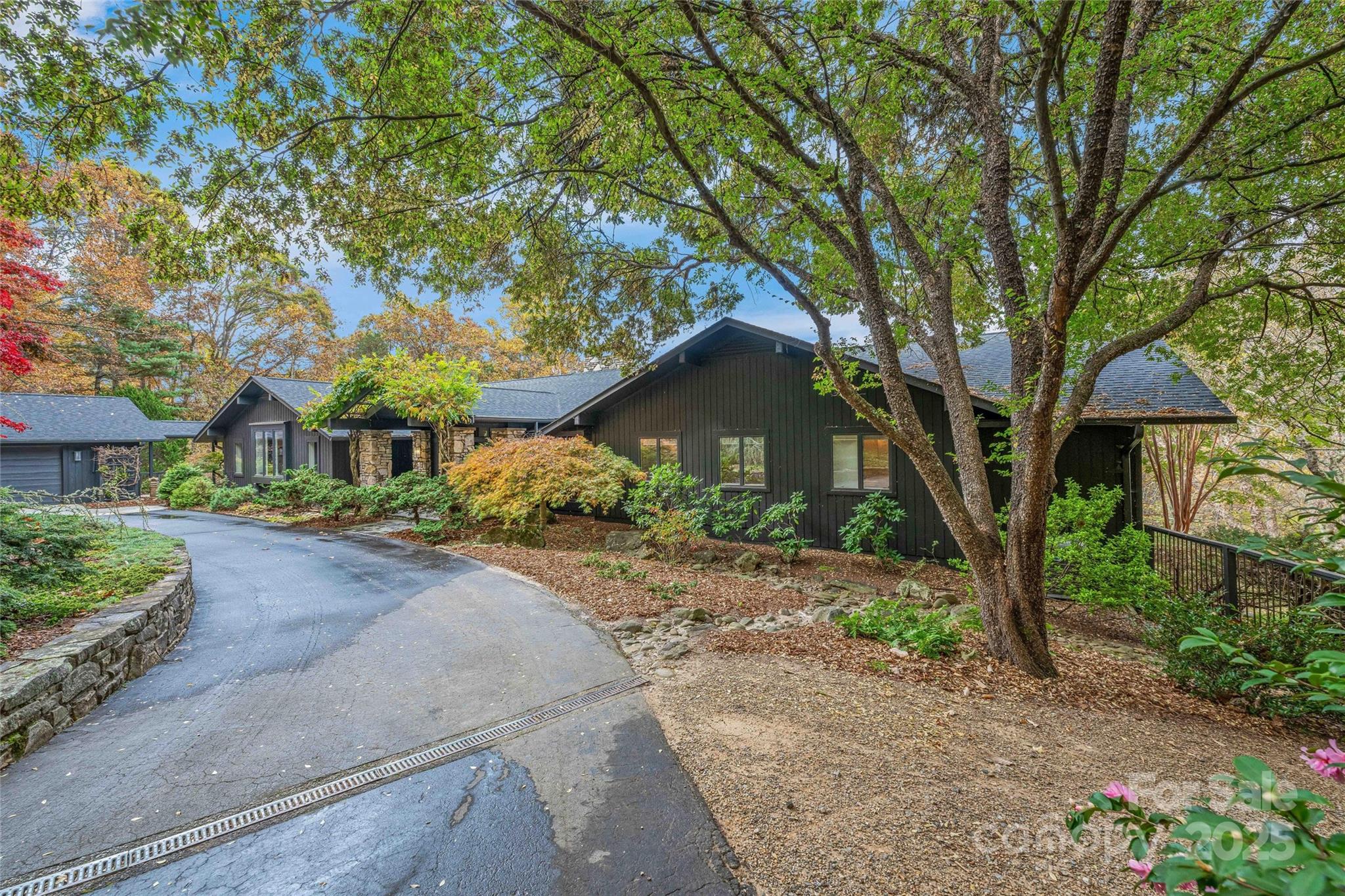 Discover a tranquil Asheville retreat that seamlessly blends serene mountain living with easy access to city conveniences. Here, you’ll take in sweeping landscapes and mountain views while spotting incredible wildlife—from soaring hawks and falcons to songbirds and black bears.

This home provides effortless, one-level living with three ensuite bedrooms on the main floor and a fourth ensuite downstairs, perfect for guests. Fully renovated, the interior exudes cozy mountain charm with modern comforts. Step outside to explore private hiking trails, challenge yourself on the wooded disc golf course, or unwind in the swimming pool, all set amidst lush, mature landscaping.

Ideally situated, this home offers quick access to Whole Foods, Trader Joe’s, Ingles, Harris Teeter, and the Blue Ridge Parkway, with the airport and hospital just minutes away. Whether you seek a full-time sanctuary or a part-time escape, this home captures the essence of Asheville living.
