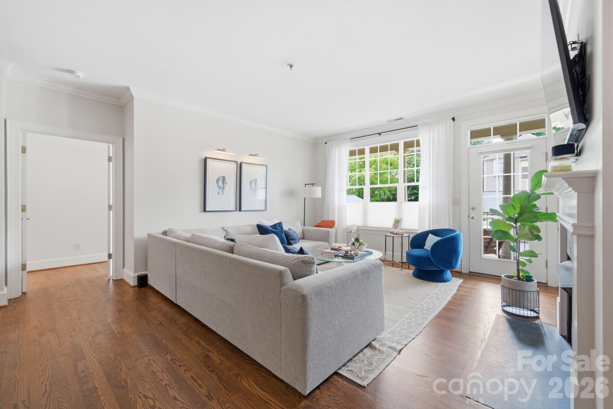Welcome home to this inviting 2-bedroom, 2-bathroom condo in the heart of Dilworth, offering the perfect blend of comfort, convenience, and urban accessibility. Filled with natural light, the thoughtfully designed open floor plan creates an ideal space for both everyday living and entertaining. The spacious living room serves as the heart of the home, featuring a cozy gas fireplace and plenty of room for a large sectional—perfect for gathering with family and friends. The kitchen and living areas flow seamlessly together, creating an airy and welcoming atmosphere. Enjoy added privacy with bedrooms situated on opposite sides of the condo, making this layout ideal for guests, roommates, or a dedicated home office setup. Head outside to your private balcony, the perfect spot to unwind with your morning coffee or enjoy a relaxing evening. A rare bonus, this condo includes its own private garage, providing secure parking and valuable additional storage space. Located just moments from Freedom Park and some of Dilworth's favorite local destinations, you'll love the convenience of having coffee shops, Taco Mama, and other popular dining and shopping options right outside your door. Experience the best of urban living in one of Charlotte's most sought-after neighborhoods.