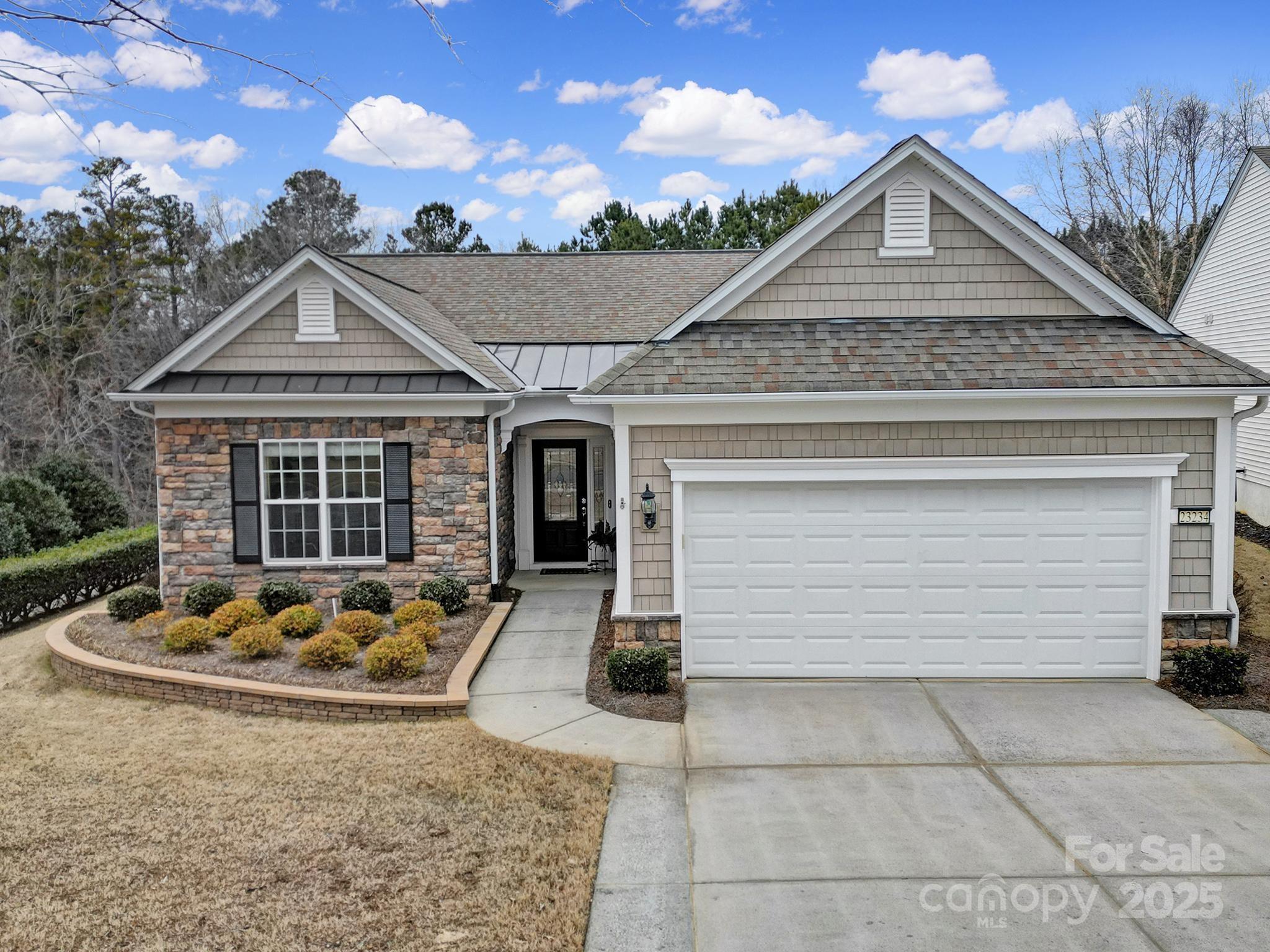 This charming ranch home in an absolute ideal location within the community is tucked away on a private wooded lot. Home features a welcoming open layout with plenty of natural light and warm, inviting spaces. The living room is perfect for relaxing, while kitchen boasts ample storage and counter space, ideal for home cooking and entertaining. The wooded lot offers ultimate privacy and a serene, park-like setting—perfect for gardening or simply unwinding surrounded by nature. The sunroom provides the perfect spot for morning coffee or evening relaxation, overlooking the lush greenery. Living in this community offers a wealth of amenities and activities designed for an active and engaging lifestyle. From clubhouses and fitness centers to organized events, there's always something to enjoy. Just minutes from Lake House, Grocery Store, Medical Offices, UPS Store, and Library! This home blends comfort and a vibrant community lifestyle making it a perfect choice for sophisticated living.