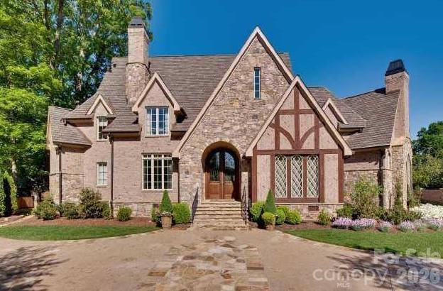 Rare opportunity for custom home located one of Foxcroft’s premier street.  New interior paint and carpet. Primary on main. Large kitchen with 2 islands, separate pantry, and wine room. Hardwood floors, high ceilings, large formal areas, and custom millwork throughout. Features include 3 floors, all with elevator access complete with all ensuite bedrooms, cedar closet, abundant storage, bonus room and gym. 4 car garage, pool, sport court, covered outdoor living with fireplace & grilling area. Professionally landscape yard with mature trees offers privacy and gated entry to circular drive. Easy access to neighborhood swim & tennis club (membership required) and walking trails.