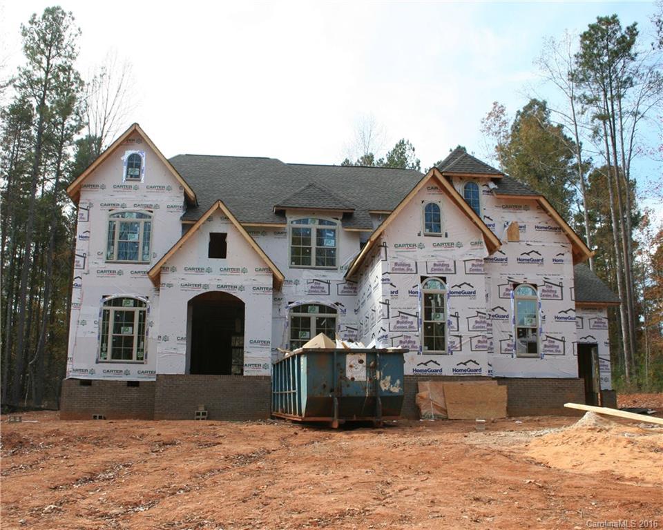 Perfect timing! Truly custom Lake Wylie gem on large wooded lot with water views.  Master bedroom with sitting area, dream bathroom, and huge Master closet.  Framed, wired, and awaiting your selections.  Plans include 2 gas fireplaces, one in great room, and one in keeping room, off kitchen.  Den with closet on main level. Custom moldings & built-ins throughout.