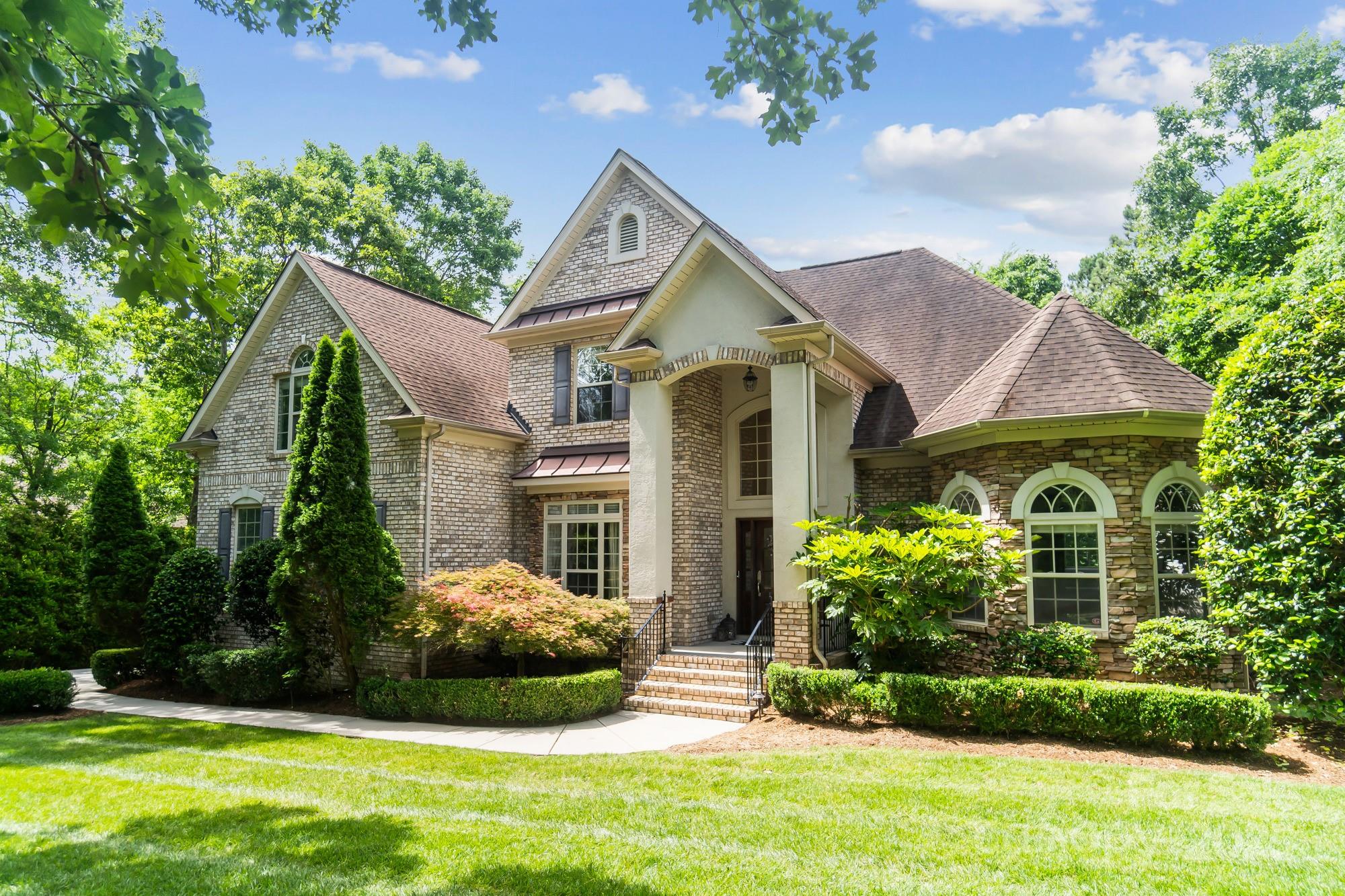 Welcome to this impeccably maintained brick home in the highly sought-after Heron Cove community! This spacious home offers two bedrooms on the main level, including a luxurious primary suite with a sitting area, tiled shower, and jetted tub. The open floor plan is ideal for entertaining, featuring a large kitchen island, a coffered ceiling in the great room, and a cozy gas fireplace. Upstairs includes two more bedrooms, an office, and a massive bonus room. Enjoy the private, tree-lined fenced backyard, fire pit, and a rear deck perfect for grilling or relaxing with your morning coffee. Community amenities include a pool, playground, and access to Lake Wylie for kayaking, canoeing, or paddleboarding. Located in the award-winning Clover School District with easy access to Charlotte Douglas Airport, shopping, and dining. Don’t miss this opportunity—homes in this neighborhood often sell for well over $800K!     OPEN HOUSE SUNDAY 5/25/25 2 TO 4 PM. SHOWINGS START SATURDAY 5/24/25