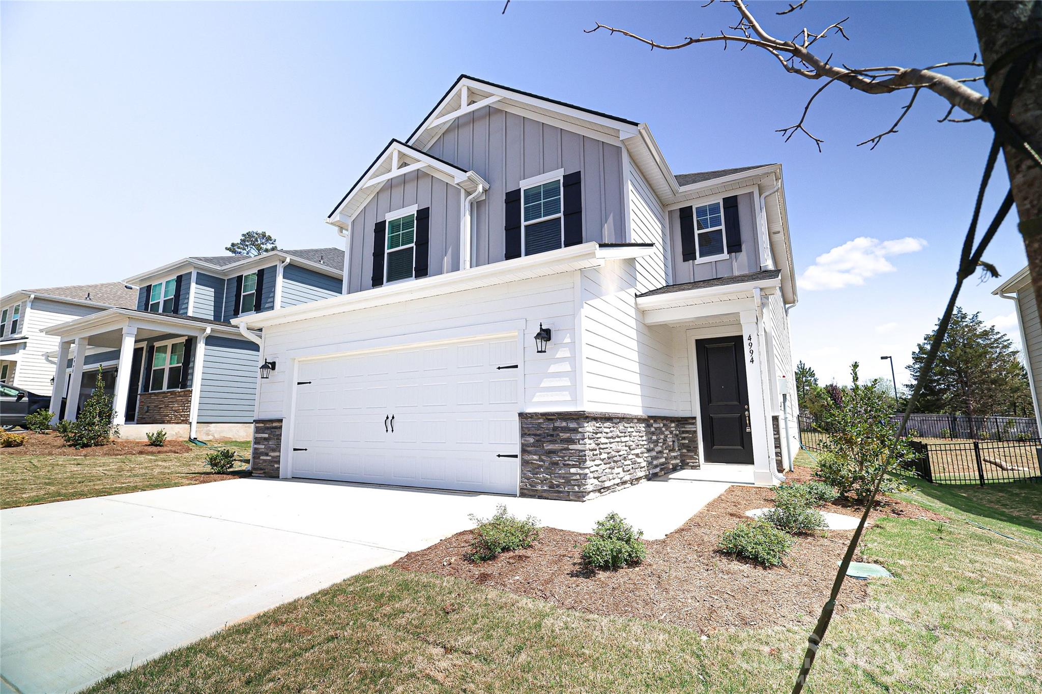 Beautifully finished new construction home in the Rivercross Community. The home features smooth 9' ceilings on the main level, upgraded interior doors, and durable LVP flooring installed throughout. The kitchen offers stainless steel appliances, quartz countertops, a large island, and crisp white cabinetry with modern hardware. The primary suite includes raised-height cabinetry, quartz counters, and dual undermount sinks. Secondary baths feature matching finishes and coordinated brushed-nickel fixtures for a cohesive look. Energy-efficient systems include a high-efficiency heat pump, programmable thermostats on each floor, enhanced insulation in walls and attic, LED lighting, and an electric water heater. Additional conveniences include an EV-ready outlet in the garage, cordless window blinds, and organized shelving in closets, pantry, and laundry. Exterior highlights include fiber-cement siding, architectural-style roofing, engineered structural systems, a concrete front porch and rear patio, and established sod for great curb appeal. A move-in-ready home with modern finishes, thoughtful upgrades, and quality construction throughout.The Rivercross Amenity Center features a Clubhouse, Fitness Center and Pool. The clubhouse serves as a gathering place for scheduled community events and programs. Stocked with new exercise equipment, the fitness center is perfect for residents who would like to stay in shape and live healthy. Lastly, the community pool is the perfect place to lounge, take a dip and stay cool during summer. Up To $20,000 in buyer incentive money! Must use builders preferred lender and closing attorney. Home must close in 30 days!