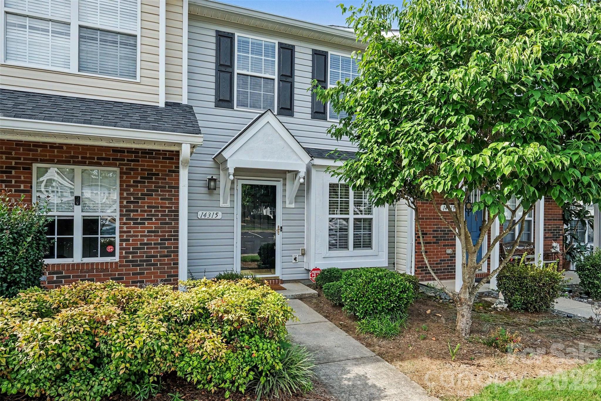 No Rental Restrictions! LOW monthly dues include includes pool/water/sewage/trash. (Roof replaced in 2021). Welcome to low-maintenance living at its finest! This well-maintained 2-bedroom, 1.5-bath townhome located in Steele Creek, just minutes from Charlotte and convenient to I-77, Carowinds, McDowell Nature Preserve, Lake Wylie, Charlotte Douglas International Airport, Charlotte Premium Outlets, dining, entertainment, and all other everyday conveniences. Residents enjoy access to the community swimming pool, assigned parking with guest spaces, and beautifully maintained grounds featuring mature landscaping and attractive curb appeal throughout the neighborhood. Inside, you'll appreciate the warm wood flooring, neutral paint palette, and abundant natural light that fills the main level. The spacious living room flows seamlessly into the dining area and kitchen, creating a comfortable and functional layout for everyday living and entertaining. Just off the dining area, a private back patio provides the perfect space to relax or host guests. The kitchen features tile flooring, wood cabinetry, granite countertops, stainless steel appliances, and a custom tile backsplash. Upstairs, you'll find two generously sized bedrooms, including the primary suite, along with ample closet space and a convenient Jack-and-Jill bathroom. Offering an exceptional combination of location, convenience, affordability, and move-in-ready condition, this charming townhome is ready to welcome its next owner. Schedule your tour today!