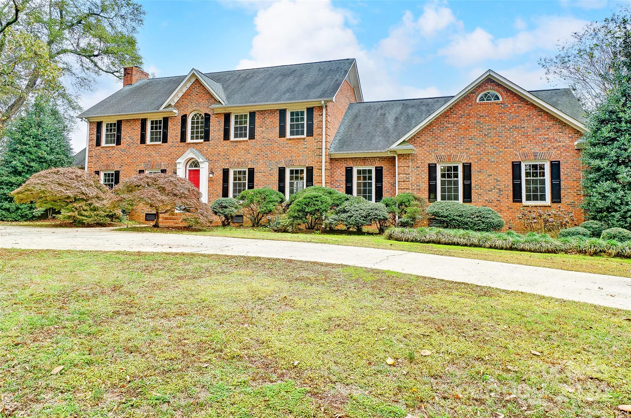 Hard to find a property that sits on 2.33 acres within walking distance of main street of Fort Mill, offering shopping, restaurants, and breweries. Beautiful property with mature landscape, In-ground pool, and a  finished barn, with heat/ac, tankless hot water heater. Which could be used as an airbnb or bed and breakfast opportunities.  Home features include formal dining room and living room with stunning built-ins and newly finished hardwoods and fresh paint.  Also on the main level is great room with built-ins, office/study and guest bedroom. Kitchen with center island gas cooking, granite counters and dual ovens. Second floor has 4 bedrooms including primary w/bath, huge bonus room and game room with billiard table. Enjoy the peace and tranquillity offering room to roam with the fenced backyard and beautiful views.  Be sure to put this home on your list to show it will not disappoint.
