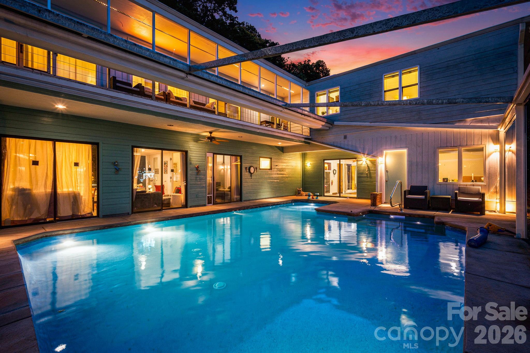 Come home to Hendersonville and take a swim in your indoor/outdoor in-ground salt water pool!  This home is refreshing in so many ways. Spacious three-bedroom home with bonus room has over 3000 square feet.  Entertaining friends and family is a breeze and the kitchen is a chef's delight with gleaming marble countertops. New roof 2021; new water heater 2022; quartz in all bathrooms, new shower in downstairs bathroom in 2021 and new shower in upstairs bathroom in 2024.  The heated pool is open for use in all seasons with a fully retractable roof. Level 2 car charger install in the garage. Come see for yourself all the wonderful reasons to make this house your new home or investment rental!