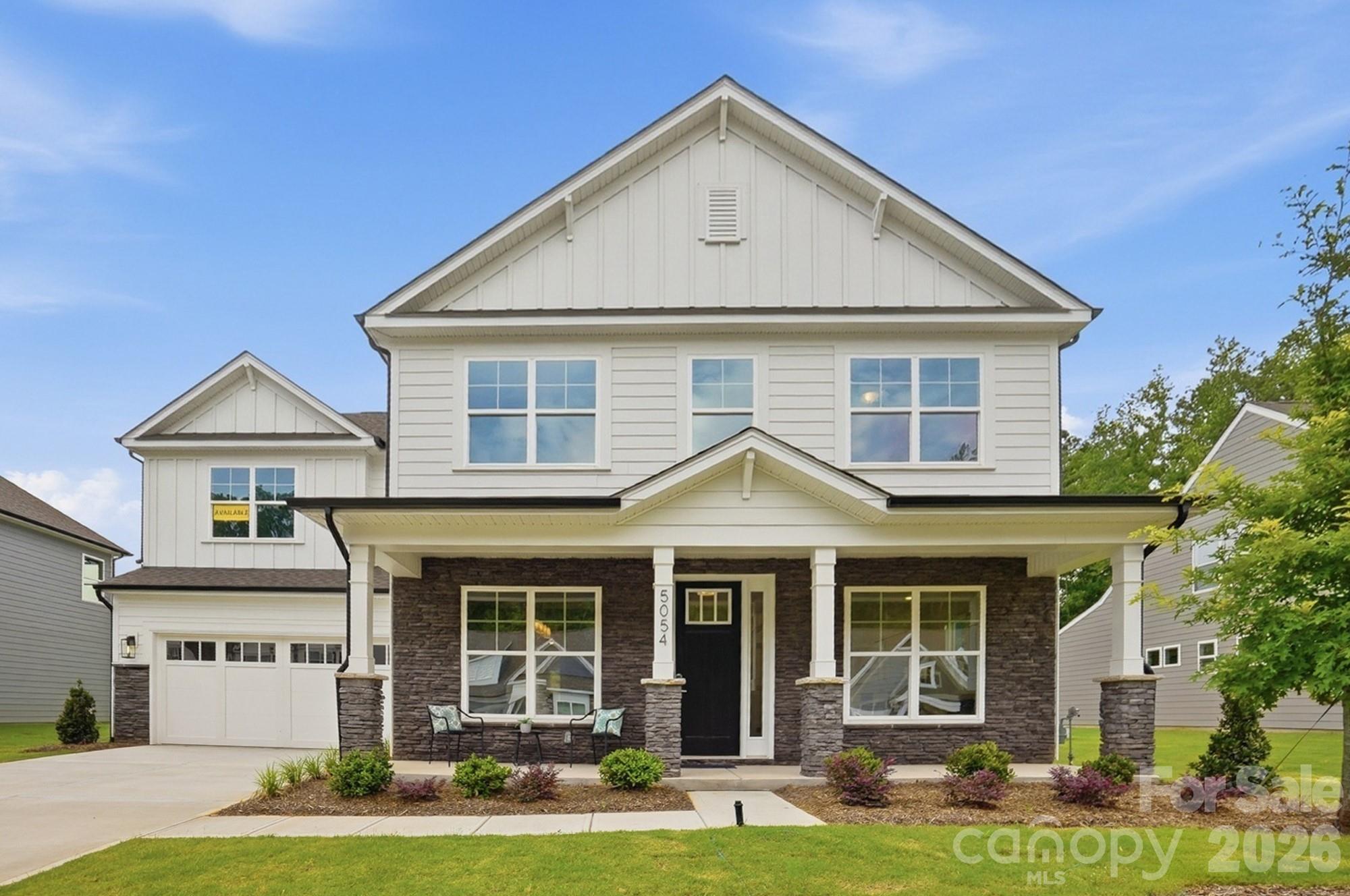 This Colfax plan features a guest suite on the main with an ensuite bath AND a secondary bedroom upstairs, also with an ensuite bath. The home has 5 bedrooms, 4.5 baths in total with more than 3,400 square feet of living space. The main floor features a designer kitchen with a butler pantry, family room with Cosmo fireplace option and shiplap feature wall, powder room, dining room with tray ceiling, and an office with French doors and a faux coffered ceiling. The kitchen features quartz counters, a tile backsplash, and stainless appliances, including a gas cooktop, range hood, and wall oven. The upper floor has 9-foot ceilings & includes a loft with EVP flooring, primary suite with EVP flooring in the bedroom, three secondary bedrooms, two full baths, and the laundry room. All the bathrooms have quartz counters and give you plenty of options: a luxury shower in the primary, a tiled, 4-foot shower with bench seat in the guest suite, a tiled, 5-foot shower in the upstairs secondary suite, and a tub/shower combo with tile surround in the upstairs hall bath. Other wonderful extras include a rear screened porch, tray ceiling in the foyer and primary, laundry room with cabinets, and a beadboard drop zone in the mud room. This home has it all and more! Visit this wonderful home and community today!