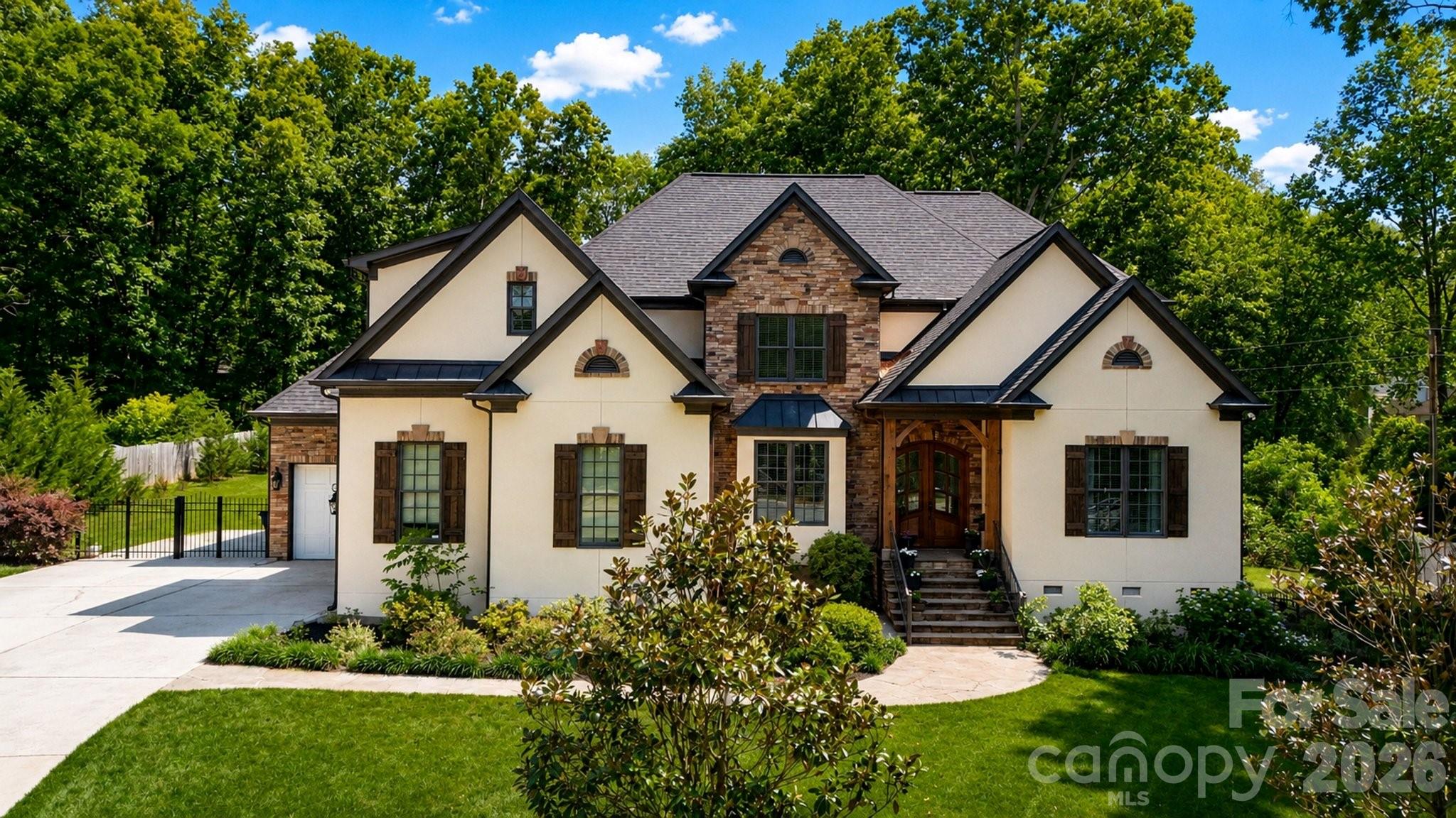 Welcome to this stunning custom built home in the desirable Red Oak Estates community of Mint Hill. Perfectly situated on a spacious 0.68 acre lot, this elegant 5 bedroom, 3.5 bath residence offers privacy, timeless design, and exceptional craftsmanship throughout.

Built in 2006 by Ed Shirley, this home was one of the original custom homes in the neighborhood and was originally listed in the high $800s back in 2007, reflecting the quality, detail, and upscale finishes that still stand out today. One of the few homes in the area with No HOA enjoy full freedom and lower carrying costs without any homeowners association fees or restrictions.

Step inside to an impressive interior featuring hardwood floors throughout the main level, soaring ceilings on both floors, detailed moldings, and a bright, open layout designed for comfortable living and entertaining. The gourmet kitchen is a true centerpiece, offering a large center island, professional-grade appliances, generous pantry storage, and beautiful custom built-ins. The kitchen flows seamlessly into the main living areas, including a spacious great room with a cozy gas log fireplace.

The first-floor primary suite provides a private retreat with a luxurious spa-like bath, creating the perfect place to unwind. Upstairs, you will find spacious secondary bedrooms, well-appointed bathrooms, and flexible living areas ideal for a bonus room, media space, office, or guest accommodations.

Outdoor living is just as impressive, with a covered back porch overlooking the private backyard, offering the perfect setting for relaxing, entertaining, or enjoying the peaceful surroundings and enjoy looking at birds while drinking your morning Coffee.

Located in one of Mint Hill’s most desirable communities, this home combines custom quality, elegant finishes, generous space, and a premium lot in a convenient location close to shopping, dining, parks, and major roadways. A rare opportunity to own a beautifully crafted custom home in Red Oak Estates community. Do not miss on this rare opportunity and schedule your showing today.