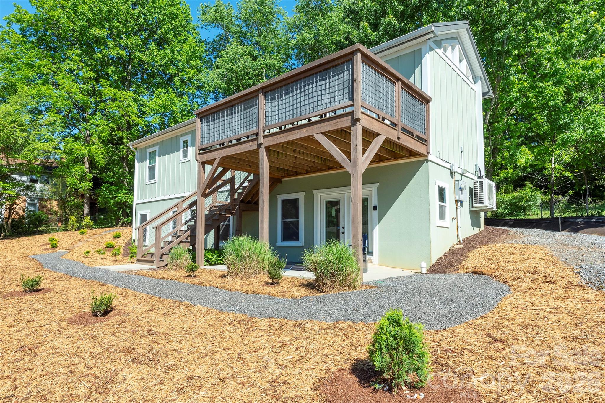 Mountain views, proven short-term rental income, and a walkout basement ready for future potential, all less than a mile from downtown Black Mountain.

This thoughtfully designed 2021 mountain home offers south-facing exposure and sweeping views of Jesse’s Hightop and Black Knob Peaks, filling the home with natural light throughout the day. Just a short drive to Asheville, the location combines mountain setting, small-town charm, and easy access to one of Western North Carolina’s most vibrant cities.

The main living space features natural wood floors, vaulted tongue-and-groove ceilings, and an open layout that feels warm, inviting, and connected to the surrounding mountains. The kitchen includes custom quartz countertops and flows comfortably into the living area, creating a welcoming space for gathering after a day exploring the trails, restaurants, and shops that make Black Mountain such a beloved mountain town.

The flexible layout includes a bedroom with office space, a custom reading loft, and a bright primary suite, making the home well suited for full-time living, a mountain retreat, or continued rental use.

A standout feature is the fully separate walkout basement built with Superior Walls, offering windows, exterior access, plumbing stubbed for kitchen and bathroom (shower/lav/toilet), and a transferable Superior Walls warranty. The space provides exceptional potential for a guest suite, artist studio, recreation room, private apartment-style living area, or expanded rental opportunity, giving buyers the ability to create additional value over time.

With mountain views, proven rental performance, and room to grow, this property offers a rare opportunity in one of Western North Carolina’s most desirable mountain communities. Conveniently located near Montreat, Blue Ridge Assembly, and Asheville, it provides easy access to both nature and culture while remaining close to the heart of downtown Black Mountain.