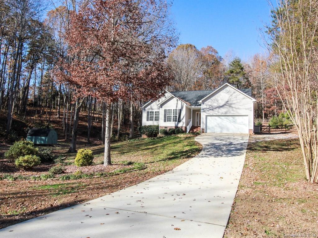 Home surrounded by BEAUTIFUL natural WOODED landscape on 1.6 ACRES. Enjoy the ease of COUNTRY SETTING--pool, end of cul-de-sac lot, quiet & well maintained neighborhood. Ranch with hardwoods through out. Lots of windows to allow natural light in.  Home is in mint condition, large living area open to kitchen with stainless steel appliances. Master Suite boasts space & vaulted ceiling, jetted tub. French drain in back yard. Outbuilding shed. Convenient to shopping, restaurants and more