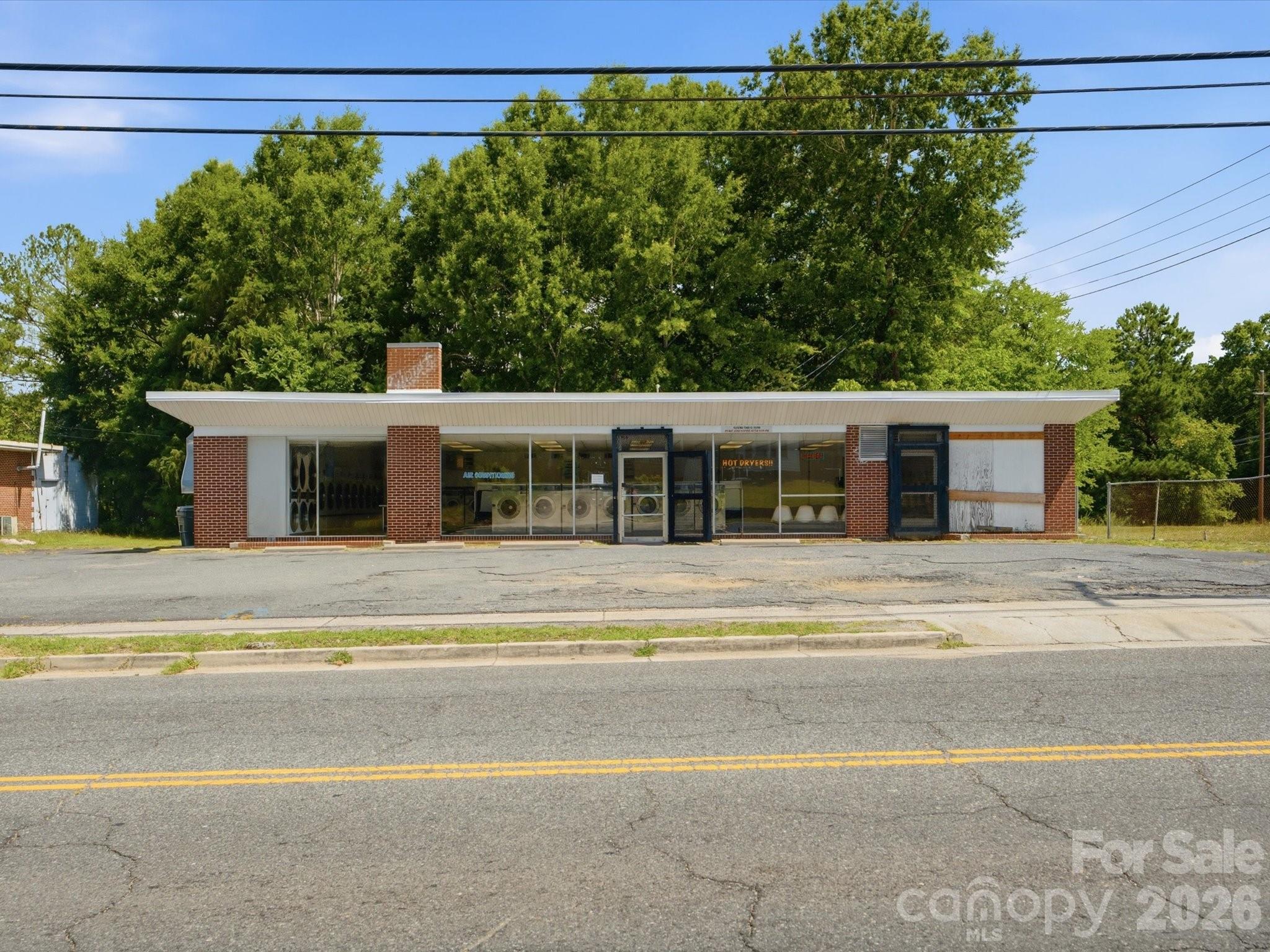 Excellent opportunity to acquire the commercial real estate at **159 Pinckney Street** along with an established operating laundromat business. This freestanding commercial property is being offered as part of a two-property portfolio sale that also includes **250 Gadsden Street MLS #4402236.

Situated on approximately 0.85 acres, this established location provides excellent customer access, ample on-site parking, and has served the Chester community for years. The property has been well maintained and features several recent capital improvements, including a new roof installed in 2020 and a packaged HVAC unit replaced in 2024, helping reduce future maintenance expenses for the next owner.

The sale includes the operating business, commercial real estate, furniture, fixtures & equipment (FF&E), and customer goodwill. Buyers will appreciate the opportunity to expand revenue through equipment modernization, cashless payment systems, wash-and-fold services, pickup and delivery, commercial laundry contracts, and other operational improvements.

This property is part of a two-property portfolio sale. The list price reflects one-half of the total portfolio purchase price. Both properties offered at a total purchase price of $500,000.
