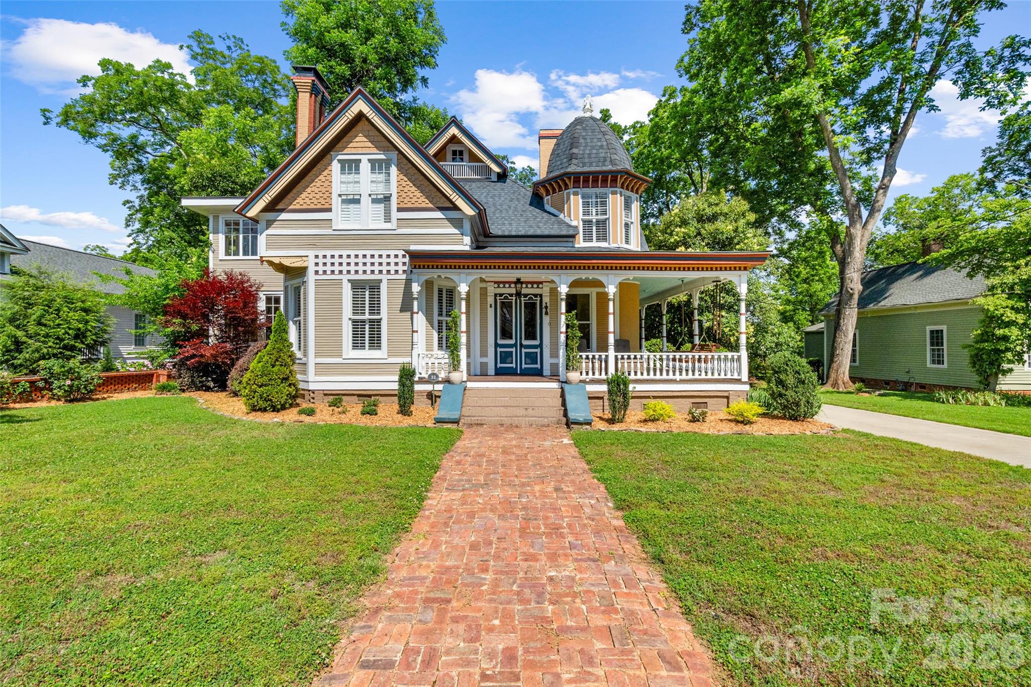 Stunning Victorian home in Historic York that honors the lavish architectural designs of the 19th century with many well-curated modern conveniences.  Enter the beautifully detailed, hand painted front doors and you'll find original features such as wood and tile flooring, ironwork, millwork, and  more.  The embossed ceiling tiles and Tiffany lamps in the front den give an authentic nod to the early nineteen hundreds.   The modernized open kitchen features solid marble counter tops, a farm sink and banquette seating for meals. The walls of windows found in the sunrooms of both the first and second floor allow an amazing amount of light into the home.  The cellar has been converted into a multi-purpose storage and prep space, adding character to the home.  The inviting wrap around covered porch is perfect for morning coffee or evening drinks, while the back yard terrace provides the space for  grilling and entertaining.  Within walking distance to the McCelvey Center and downtown York with all of its dining, shopping and entertainment.