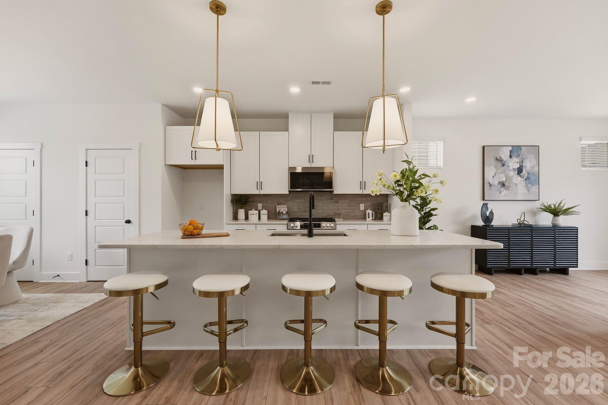 NEW CONSTRUCTION MOVE IN READY! Discover upscale living in this modern three-story townhome in desired City Park Neighborhood! Featuring a flex space, office or study on the main floor, as well as, three bedrooms and two full baths on the third floor with a half bath on the second. The open-concept second floor showcases a chef-inspired kitchen with stainless steel appliances, quartz countertops, tile backsplash and designer lighting. The primary suite offers plush carpeting, a walk-in closet, and a double vanity en-suite showcasing a floor to ceiling tiled shower. Enjoy a generous rear deck, perfect for entertaining, and the a private two-car garage with driveway. Conveniently located to Charlotte's Regional Farmers Market, Starbucks, local restaurants, as well as, a few miles from the airport, South End and Uptown Charlotte! Schedule your showing today!