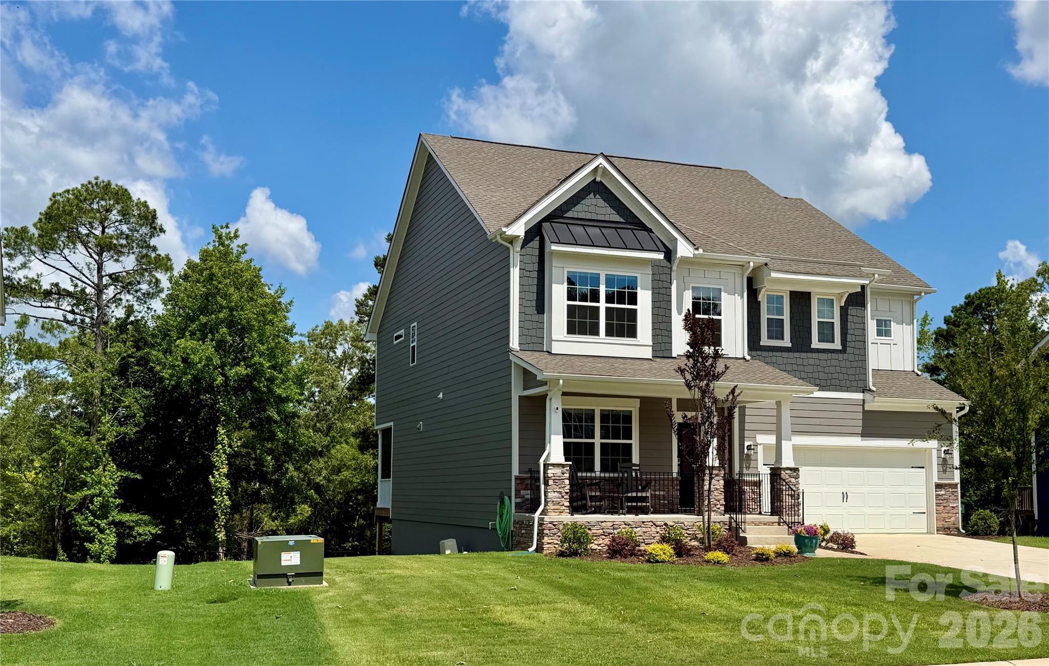 Stunning Waterfront Living on Lake Norman! This 2-year-old, better-than-new masterpiece offers 2,864 sq. ft. of finished luxury, plus an incredible opportunity to expand. The massive, unfinished walk-out basement is already plumbed and ready to add 1,150 sq. ft. of customized space—perfect for a second living quarters, home theater, or rec room—bringing the potential total to a whopping 4,024 sq. ft.!
The main level features a sweeping two-story open floor plan with hardwood flooring, extensive crown molding, a spacious dining room, and a great room anchored by a cozy fireplace and custom built-ins—all framing beautiful lake views. The gourmet kitchen is a chef’s dream, boasting a gas cooktop, wall oven, massive prep island, tons of cabinetry, a walk-in pantry, and a butler’s pantry.
Upstairs, the oversized primary suite is a private retreat with two walk-in closets and a spa-like bath featuring an oversized tiled shower. Three additional bedrooms, two full baths, and a generous loft/family room complete the upper level.
Enjoy the lake breeze from the covered front porch or the two covered back patios. The fully fenced yard features 3 gates, one to the lake, in-ground irrigation and those views! No neighbor behind you! Even the garage floor shines with a custom epoxy finish, and the entire home is equipped with smart technology. Located just one mile from full service Marina and Lake Norman State Park boating, kayaking, fishing, and trails. See the media section for a full list of extensive upgrades!
