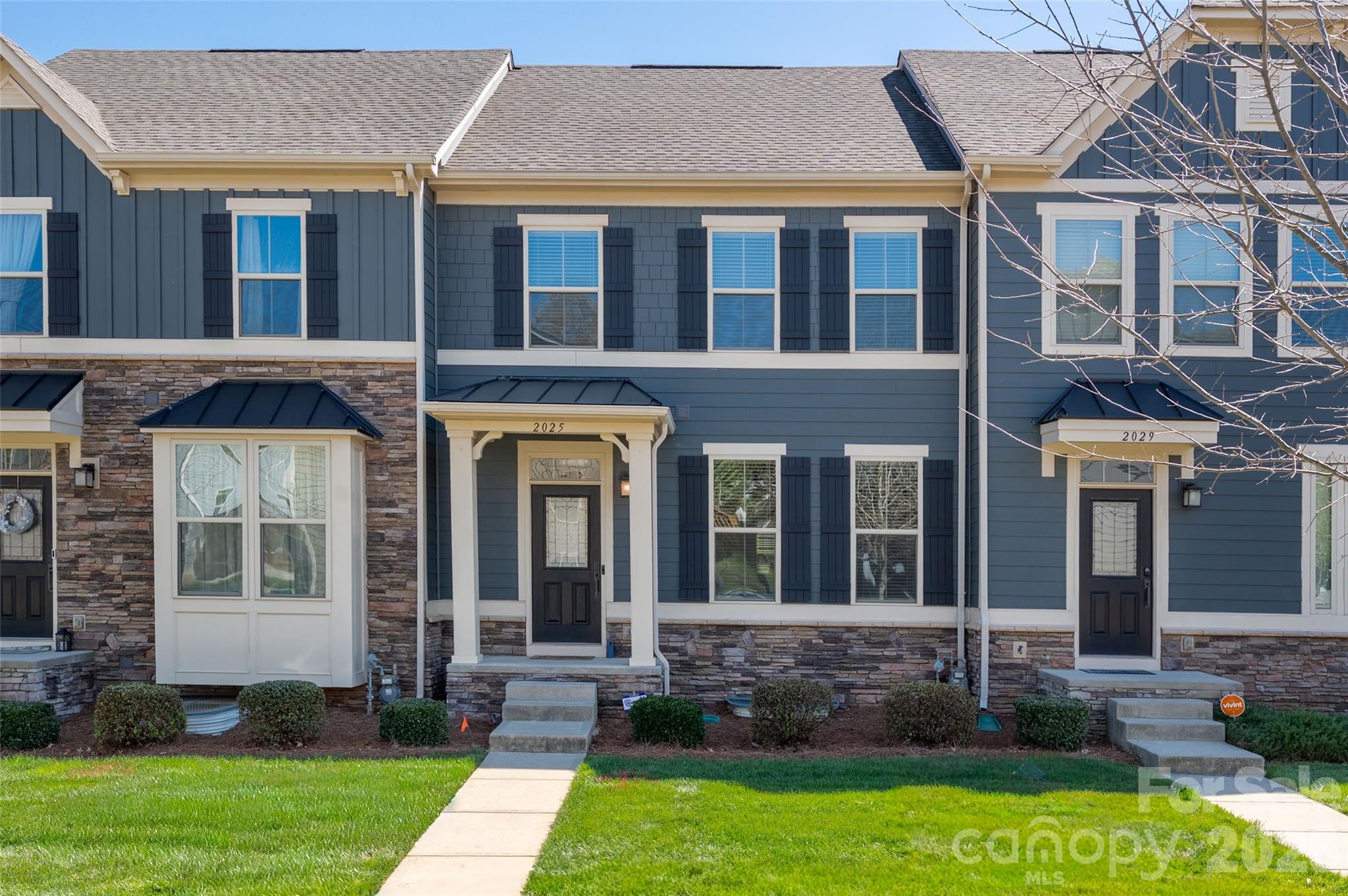 Welcome to this like-new townhome in the heart of booming Oakhurst, where convenience, lifestyle, and modern living come together. Perfectly situated near some of Charlotte’s most popular neighborhoods, this home offers easy access to Uptown, Cotswold, and SouthPark while being tucked into a quiet, walkable community.

Enjoy the ability to walk to local favorites like Night Swim, Jersey Mike’s, and nearby shops and restaurants, with multiple parks just a 5–10 minute drive away. High-speed connectivity is covered with both AT&T and Google Fiber available.

Inside, the open floor plan is designed for both everyday living and entertaining, featuring beautiful wood floors throughout the main living area. The spacious kitchen is a true centerpiece with a large island, breakfast bar, abundant cabinetry, and a dedicated dining area. Upstairs, you’ll find three bedrooms, two full baths, and a convenient laundry room. The primary suite offers a tray ceiling and a generous walk-in closet.

The lower level provides a versatile multi-purpose room perfect for a home office, workout space, study, gaming, or recreation room. Step outside to the rear deck complete with a natural gas line for easy grilling.

A two-car garage is accessed from a private rear street, with additional parking conveniently located out front. With its unbeatable location, thoughtful layout, and move-in ready condition, this Oakhurst townhome truly has it all.