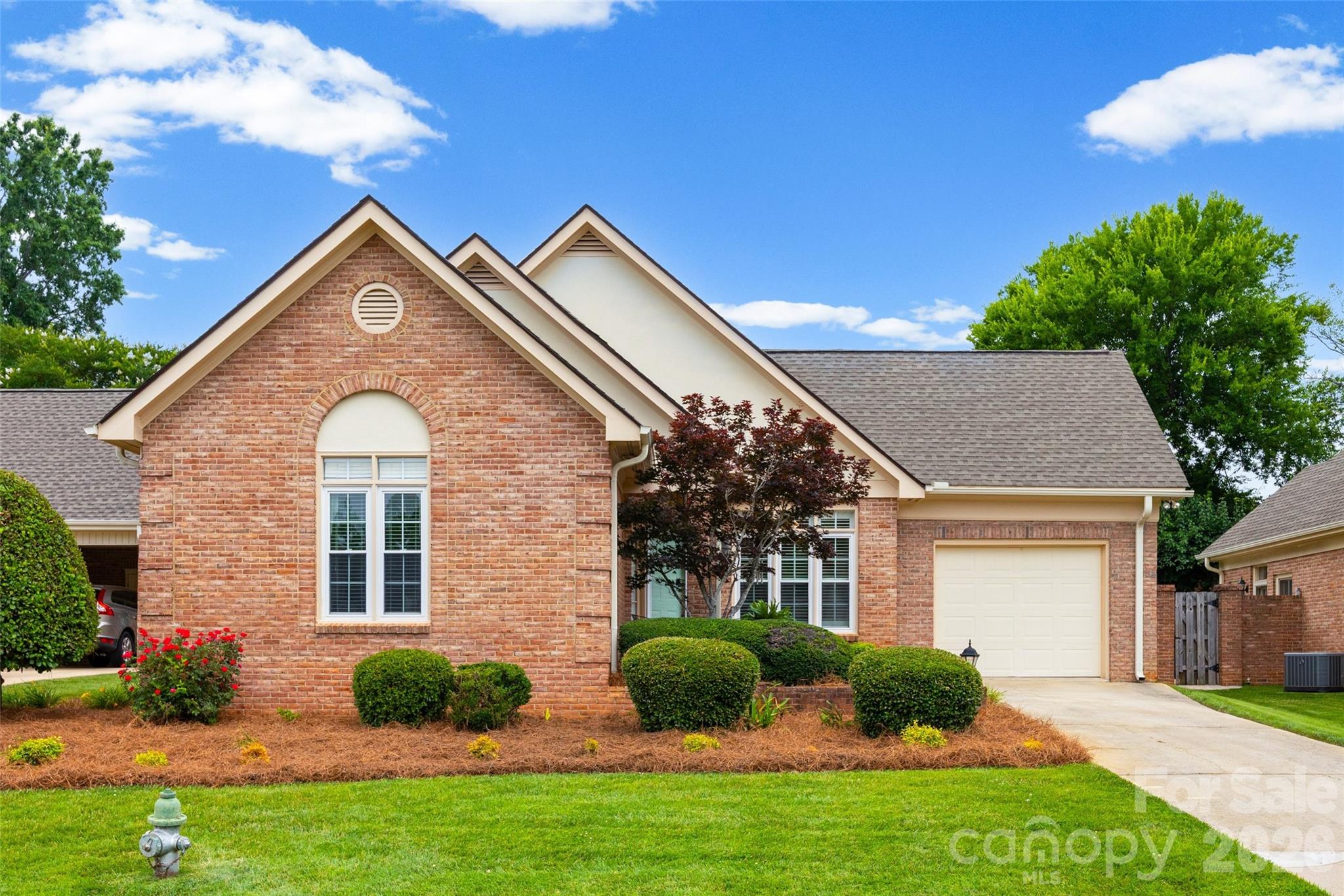 This bright, brick patio home in Rock Hill’s Morgan’s Glen neighborhood features three bedrooms, two full bathrooms, and a practical layout enhanced by classic hardwoods and brand-new bathroom vinyl flooring. Dual energy-efficient sky tubes flood the living space with sustainable natural light, while the private backyard, personal patio, and rare one-car garage provide an exceptional blend of indoor-outdoor comfort and convenience. Perfectly positioned for effortless living, the home includes HOA-covered lawncare and sits just minutes away from the hospital, local shopping, downtown Rock Hill, and Interstate 77.