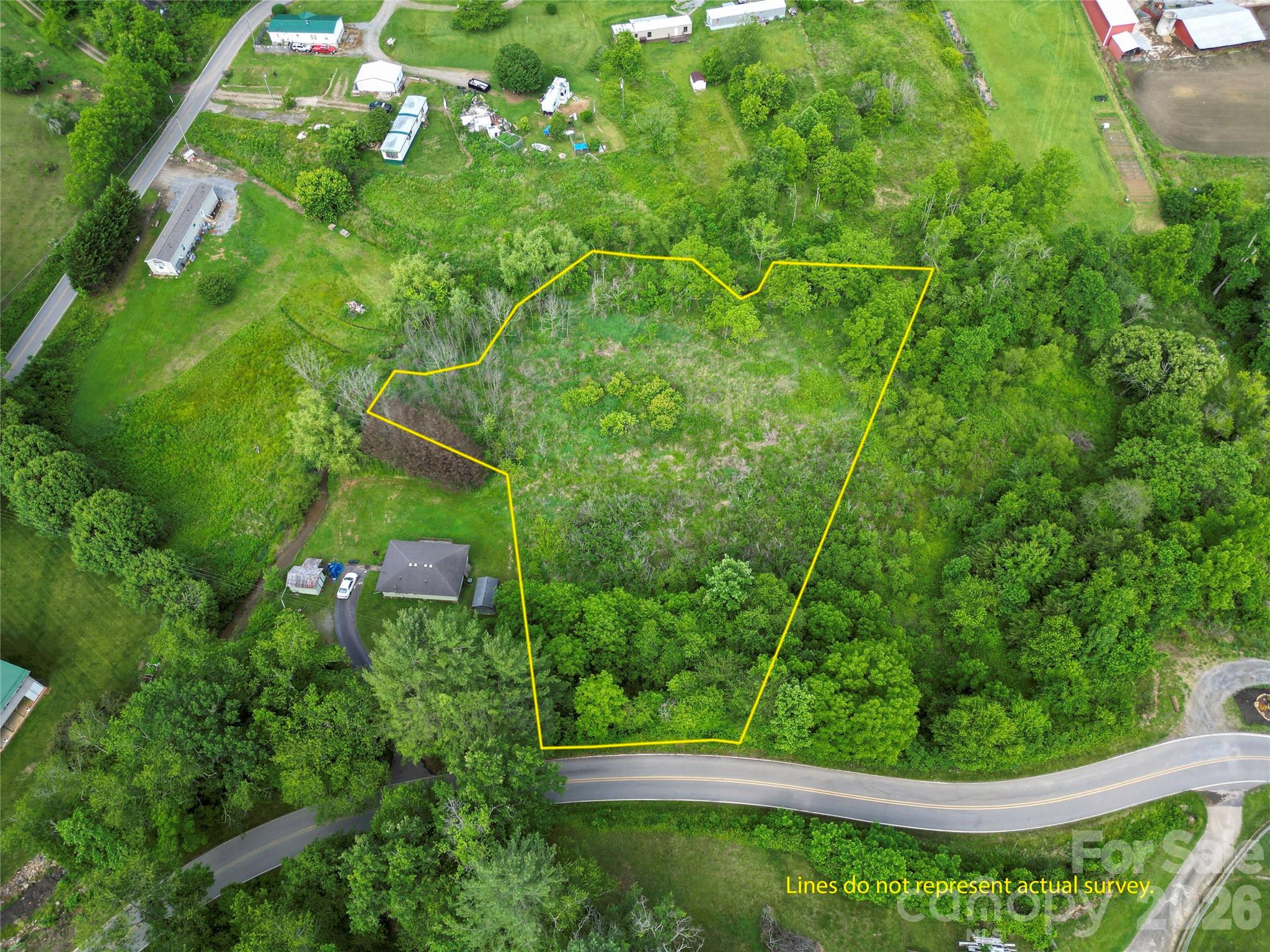 Looking for an unrestricted homesite in the mountains of Western North Carolina with room to build, privacy, and natural features? This 1.67-acre vacant land parcel off Abel Road in Canton offers a unique combination of accessibility, usable terrain, and scenic surroundings. The property slopes gently from the state-maintained road before opening into a mostly level area that may provide multiple possibilities for a future homesite, recreational retreat, or investment opportunity.

Bordered by a creek and featuring a mix of open areas and trees, this partially wooded tract offers a peaceful setting with surrounding mountain views and a natural landscape that blends privacy with convenience. A driveway would need to be established from Abel Road to access the property. With no known restrictions, buyers have the flexibility to explore a variety of uses, subject to any applicable county requirements and permitting.

Conveniently located near Canton while still offering a rural mountain atmosphere, this property provides an opportunity to create your own vision in a desirable Haywood County setting.

Property Highlights:
• 1.67 unrestricted acres
• State-maintained road frontage on Abel Road
• Mostly level area beyond the road frontage slope
• Creek bordering the property
• Partially wooded with natural vegetation
• Surrounding mountain views
• Potential homesite, recreational, or investment opportunity
• Convenient access to Canton and surrounding mountain communities
Buyer to verify access, utilities, acreage, and all intended uses. Survey recommended. Boundary lines shown in marketing photos are approximate and do not represent an actual survey.