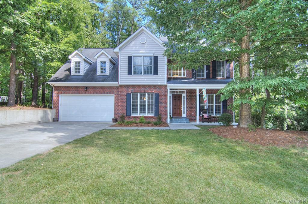 Spacious home on shady, wooded cul-de-sac street in sought after Tega Cay peninsula. Main level boasts both formals, Great Room, eat-in kitchen, and deck overlooking private yard. Master on 2nd level with luxurious bath - whirlpool tub, separate shower, and double sinks. Two bedrooms up and a large bonus room. Basement offers bedroom/bonus room, full bath, and office. Plenty of space for living & entertaining. Expanded 2 car garage. Easy bike ride to the new TCES. Tega Cay Vacation Lifestyle!