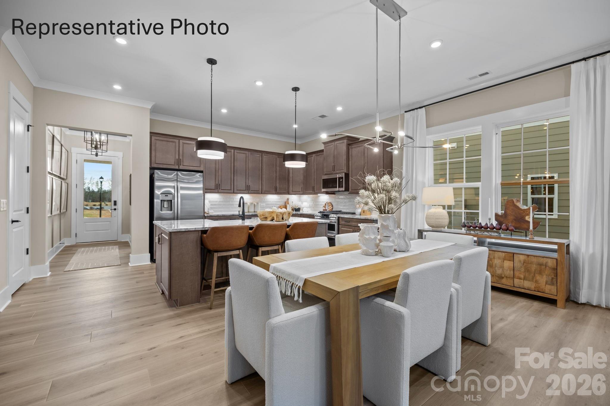 Welcome to The Virtuoso, a home where creativity and craftsmanship come together in perfect harmony. Thoughtfully designed to maximize space while showcasing your unique style, this floor plan offers a seamless blend of elegance and flexibility. From the moment you enter, the open-concept kitchen and café dining area flow effortlessly into the gathering room. Creating an inviting setting for both everyday living and memorable entertaining. This beautiful home has 10 ft ceilings with 8 ft doors, 42 inch cabinets in kitchen, and LVP in foyer, kitchen, flex room, gathering room and cafe. The Virtuoso  allows buyers to personalize finishes and features to suit their needs.