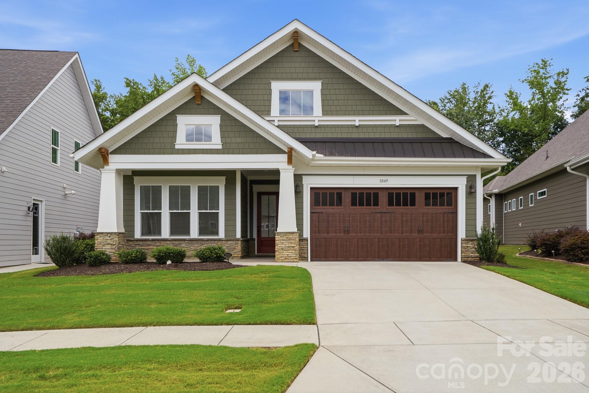 Showings start Saturday June 27 for this well loved and immaculate 3-bedroom 2 full bath one story home with an attached two-car garage backing up to WOODED HOA owned land in the Cumberland low maintenance 55+ lifestyle community with included lawn maintenance, sidewalks, dog park, putting green, club house & more minutes from shopping, dining & major roadways.  This beautiful home includes an open floor plan, spacious primary suite with large walk-in closet & en suite bath with tiled shower and seat, Kitchen with large island, recessed, under cabinet & pendent lighting, subway tile backsplash, vented hood, quartz counter tops, stainless steel appliances with gas cooktop, and wall oven and microwave, crown molding, coffered ceiling, hardwood floors in main living areas and primary bedroom, front porch, screened porch with fan overlooking the fenced yard backing to wooded HOA owned land,  gas log fireplace, drop zone, neutral paint and finishes, finished two-car garage, tankless water heater, lots of storage & more. There are too many details to list here so schedule your appointment to view.  Seller requests pre-approved or cash buyers only please.