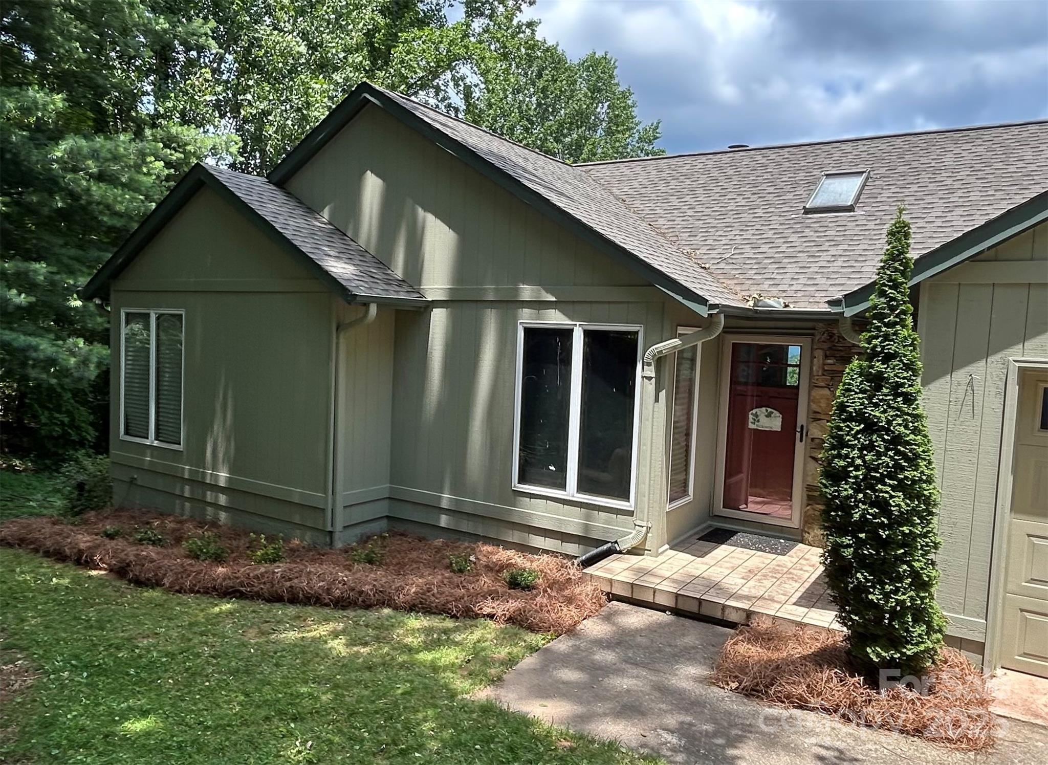 Spectacular year round mountain views from this private home in the gated Melrose Mountain community. Less than 15 minutes from downtown Tryon. Quiet,  peaceful home with 2 additional lots for a total of 2.89 +/- acres to insure privacy. Main level offers a primary bedroom with ensuite bath and access to the deck. An additional bedroom, full bath, bonus room,1/2 bath, kitchen and dining, accompany the lodge style den where the wood ceiling with exposed beams and stone fireplace create a warm atmosphere as you enjoy the long range mountain views through the expansive windows and glass doors. There's another level for friends and family. Downstairs is a large open family room with plenty of space for game tables and a designated area for watching movies or the big game. Another bedroom, bonus room, and full bath round out the lower level. There's a large deck on the back of the house with plenty of room for grilling, outdoor dining or just relaxing and enjoying the top of the mountain. Miles of roads inside the gates offer safe walking opportunities through the mountain forest. There's a lake for swimming that has a sandy beach with outdoor tables and chairs and a second lake for fishing. Both allow canoes and kayaks. Tennis/Pickleball court and a community clubhouse are also available to owners and their guests. Less than an hour to Asheville or Greenville/Spartanburg Airports