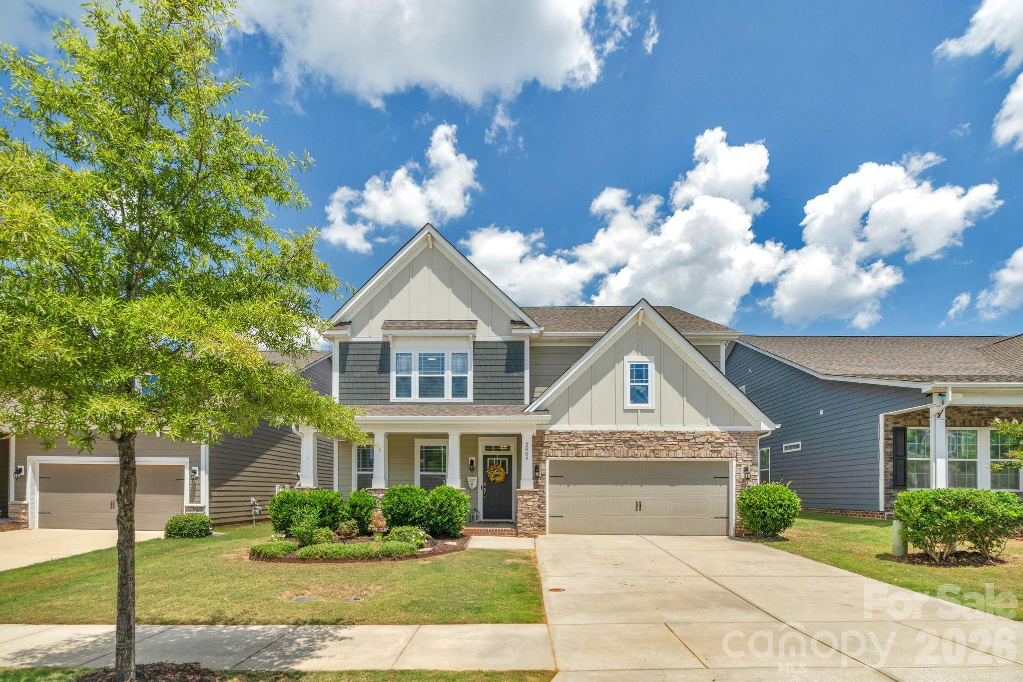Beautifully maintained one-owner home on a premium wooded lot in a sought-after resort-style community. Built in 2019, this 4BR/3BA home with bonus room offers over 3,200 sq ft of well-designed living space. The kitchen features a large island, double wall ovens, granite countertops, subway tile backsplash, soft-close cabinetry, butler’s pantry, and a custom walk-in pantry, all opening seamlessly to the main living area with gas fireplace and abundant natural light. Upstairs, the spacious primary suite includes tray ceilings, a sitting area with custom built-ins, and a spa-like bath with tile shower, soaking tub, dual vanities, and walk-in closet. A versatile loft provides flexible use, with potential for a fifth bedroom. Additional features include LVP flooring, crown molding, covered porch, extended patio, and added storage. Enjoy community amenities including pools, recreation areas, and more, with convenient access to shopping, dining, and nearby Waxhaw. Assumable loan available—contact agent for details. Lender credit with prefer lender Home Simply.