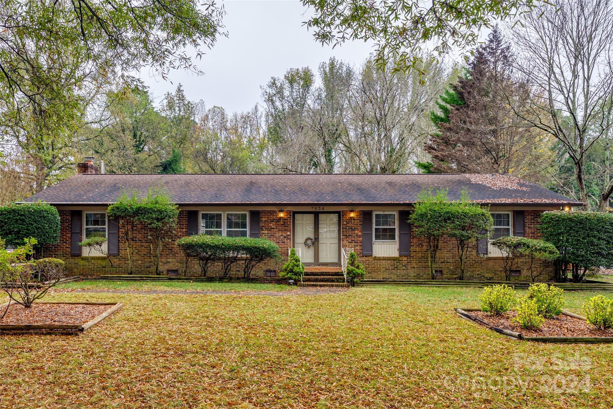 Calling all investors and bring your contractor! Sprawling full brick ranch on a large flat fenced lot with detached garage and storage building. Exterior appears to be well maintained while the interior would benefit from a full renovation. Tons of storage. Long driveway and courtyard in the fenced area provides plenty of parking space. Sold AS-IS. Bring your offers!
