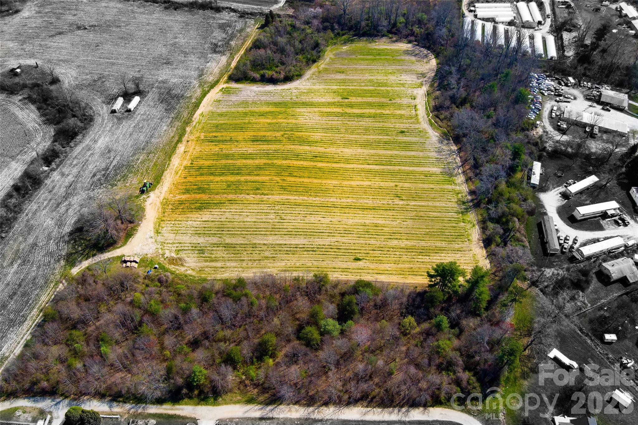 Zoned R-1, allowing up to 4 dwellings per acre, with additional flexibility for mobile homes, mobile home parks, and RV parks (mobile home and RV parks permitted via special use approval).

13.41-acre development opportunity in East Flat Rock, NC. This gently rolling property is well-suited for single-family homes or a potential mobile home or RV park concept, with a quiet setting, mature trees, and convenient access to both Hendersonville and Asheville. Located near US-176 and I-26, it offers a strong balance of privacy and accessibility. Public water and sewer may be available—buyer to verify with the county. Ideal for a subdivision, boutique community, or alternative housing development in a growing area.