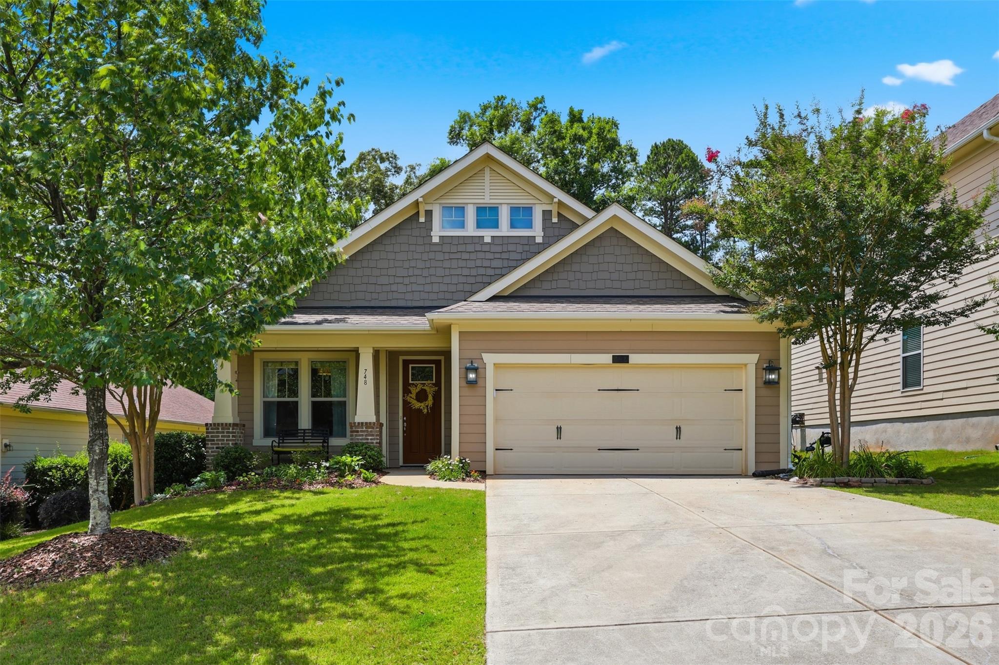 Welcome home to 748 Lagan Court, a beautifully maintained residence nestled in the highly desirable Riverchase community of Fort Mill. Situated on a spacious lot with a private wooded backdrop, this stunning ranch-style home offers the perfect blend of comfort, style, and functionality.

Step inside to discover gorgeous engineered hardwood floors that flow throughout the main living areas, creating a warm and inviting atmosphere with great natural light. The open-concept floor plan is ideal for both everyday living and entertaining, featuring a spacious living area. The dining room can also room work beautifully as a home office, playroom, or cozy den. A flex room just off the living area that can be utilized in the same ways. The chef-inspired kitchen boasts an oversized granite island, stainless steel appliances, a gas cooktop, abundant cabinetry, and a seamless connection to the dining and living spaces.

The luxurious primary suite serves as a private retreat with a spa-like bath featuring an ensuite bath with dual sinks, tile flooring, a soaking tub, separate shower, and two large walk-in closet. Two additional bedrooms offer comfort and privacy for family and guests alike. Another full bath, and a laundry room complete this level.

Step outside to enjoy a screened-in porch which is great for enjoying the sunrise as you sip your coffee before the day begins. The fenced backyard with patio, is surrounded by mature trees, creating a peaceful setting for relaxing, entertaining or using your grill or the Big Green Egg. There is also a shed that can be utilized for storage, a workshop, or she-shed.  

Fresh paint throughout the home and new luxury carpet in the primary bedroom makes this home truly move-in ready. An oversized two-car garage adds everyday convenience and extra storage.

Residents of Riverchase enjoy exceptional amenities including river access, a community pool, clubhouse, playgrounds, scenic walking trails, a disc golf course, and acres of preserved green space. Conveniently located near shopping, dining, entertainment, and award-winning Fort Mill schools, this home offers the lifestyle you've been searching for.

Don't miss the opportunity to make 748 Lagan Court your next home!