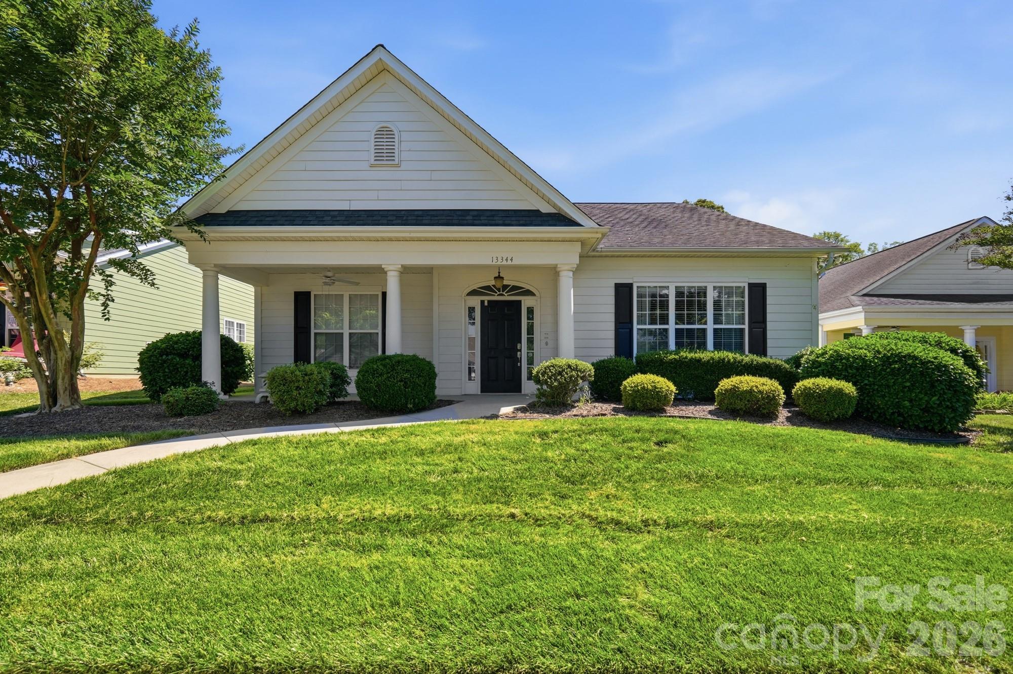 Tucked inside the Gated 55+ community of The Cottages, this charming ranch-style home welcomes you with a covered rocking-chair front porch. The setting feels peaceful and neighborly, with manicured grounds designed for truly carefree living.
A covered breezeway connects the home to the spacious two-car garage with brand new garage door, leading past a private patio and garden area with a fenced yard-perfect for quiet mornings or tending to plants in the afternoon sun.
Residents enjoy a vibrant social life with a community pool, clubhouse, and a full calendar of planned events. The location places you close to shopping, restaurants, the Light Rail and health care facilities making daily errands and outings effortless.
The Cottages is an active adult community known for its thoughtful Smart Living floorplans: This home features 9-foot ceilings, elegant tray and vaulted designs, and classic architectural columns.  No-step entries, large doorways, cathedral-style doors, and a universal design package that blends comfort with accessibility.
Inside, you’ll find Smart Reach appliances, two full baths, and a deluxe step-in shower with grab bars and raised outlets. Exterior finish is durable Hardiplank with new Leaf Guard Gutters. Grounds maintenance, irrigation, snow and leaf removal, and water are all included-freeing you to enjoy life without the chores.
Dishwasher 2 yrs, Microwave 1yr, Water Heater 1yr, Maytag washer & dryer included 3yr, HVAC unit only 5yrs.
Tree-lined boulevards, walking trails, welcoming front porches, and a beautifully maintained streetscape create a warm, connected atmosphere. It’s the perfect setting for active adults seeking a home that’s both practical and beautifully planned-truly a place where you’ll understand why residents say, “Make the Smart Move to The Cottages.”