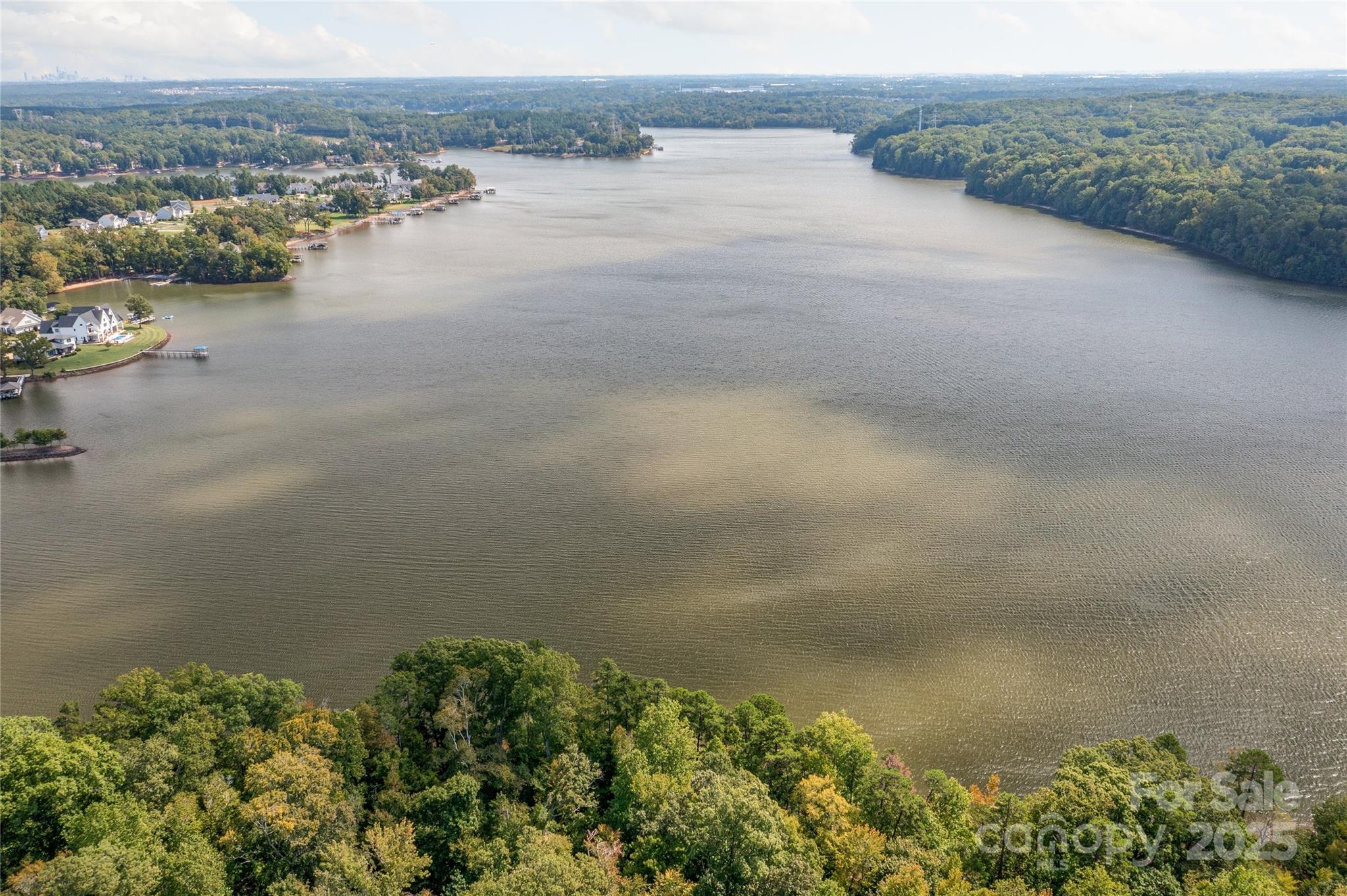 Waterfront dockable homesite in McLean South Shore in Belmont NC on Lake Wylie. Homesite 37 at 848 Lakeforest Drive, Clover SC is located on main channel with view east and south. An incredible homesite that has over 200 feet of shoreline - the homesite widens as you approach the lake! McLean South Shore offers walking trails, clubhouse, outdoor pool, fitness center, playground. Drift restaurant within walking or golf cart distance. The Carolina Thread trail along Lake Wylie located across New Hope Road. Within minutes of grocery shopping - Publix and Harris Teeter. Plus minutes from the walkable City of Belmont with its quaint vibe, festivals, park, playground, active train line - kids love watching the train, restaurants and shopping. The bustling Charlotte Douglas airport is about 15 minutes away for easy travel access. Uptown Charlotte, South Park and Ballantyne are commutable via nearby highways. Great small town location at doorstep of a bigger city! Premier waterfront community!