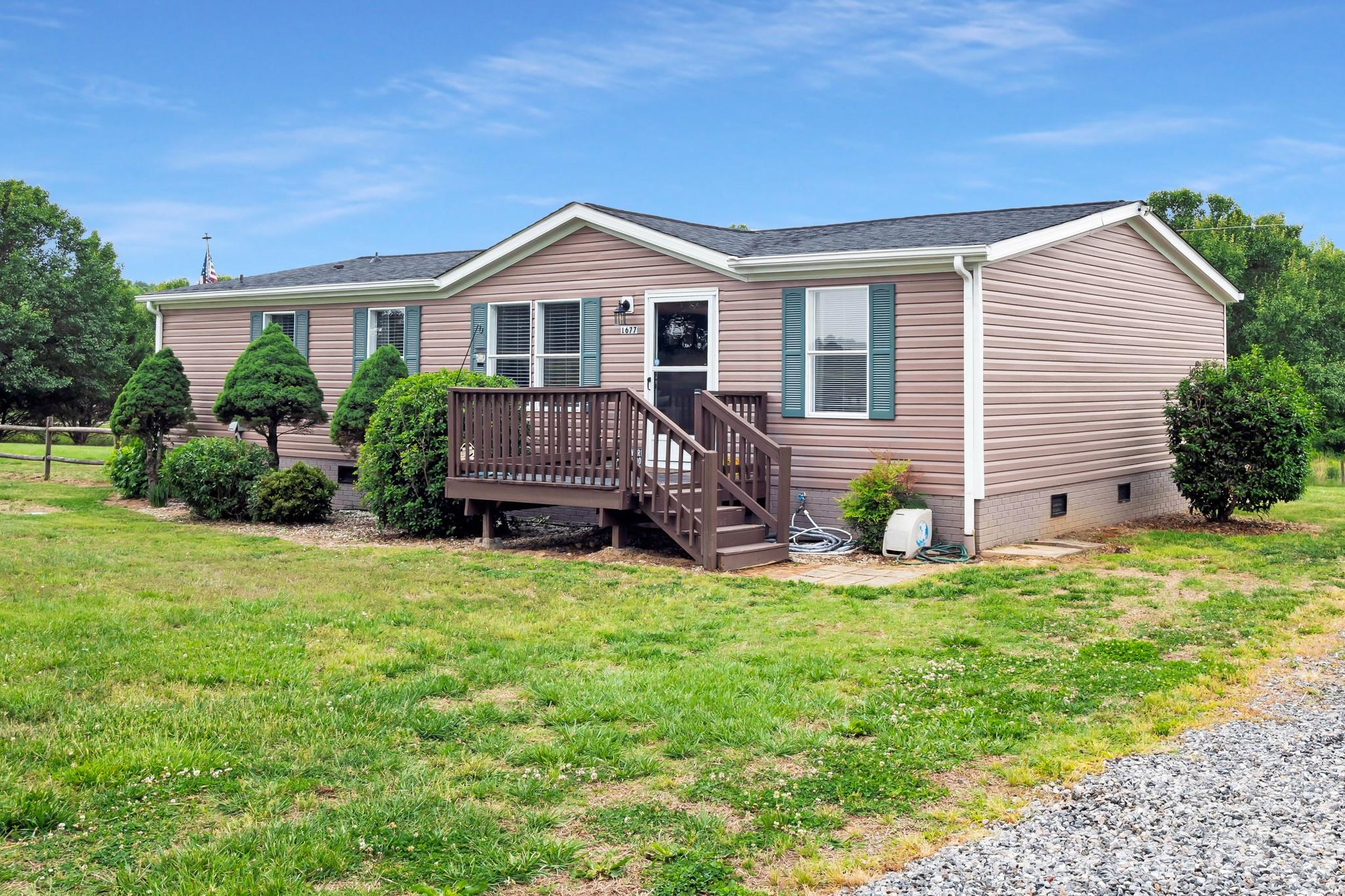 Enjoy peaceful country living on almost 2 acres. This completely renovated home. This move-in ready with open concept home features Level 5 sheetrock and custom wood trim throughout, along with all new flooring and paint. The updated kitchen comes equipped with newer appliances and countertops.
Bathrooms are completely updated!  The 2 inch blinds throughout allow you to control just how much of the natural light can flow through this home!
Outside, you’ll find a brand-new gravel driveway, RV hookup with 50-amp service, a storage building with electric and a beautifully established mature yard offering plenty of space to enjoy the outdoors. Whether you’re looking for a quiet retreat or room for your RV, hobbies, and outdoor living, this property delivers the perfect blend of comfort and country charm.

Conveniently located minutes from I 40 and I 77 for easy commute!