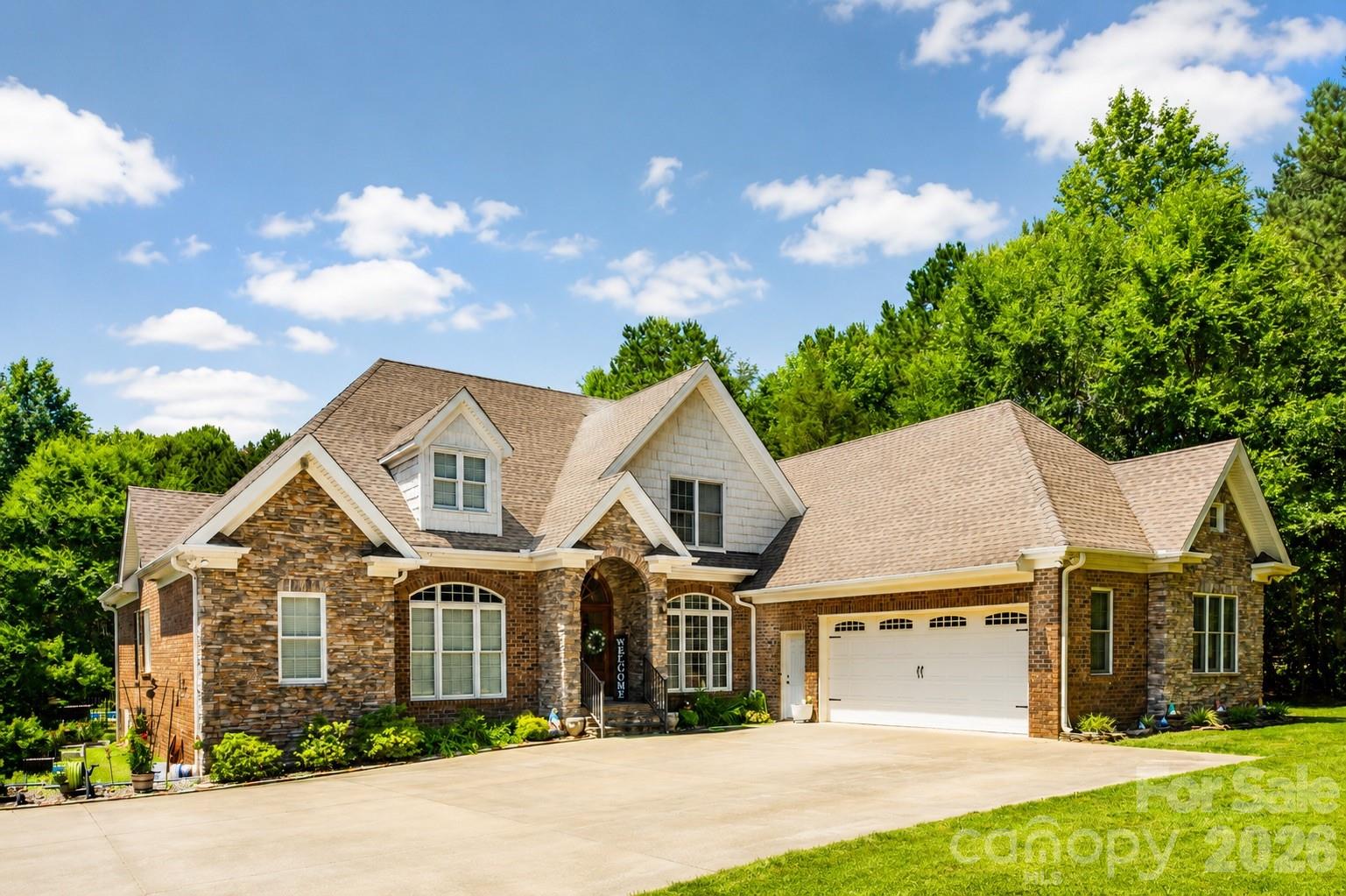 Welcome to 1347 Killian Road, a private Stanley retreat set on 6.16 acres with the space, privacy, and amenities that are hard to find this close to both Lake Norman and Charlotte. Tucked back among mature trees, this beautiful brick and stone home offers a peaceful setting with an impressive outdoor lifestyle, including a private in-ground pool, screened porch, expansive yard space, and multiple outbuildings for storage, hobbies, equipment, or workshop use. Inside, you’ll find warm hardwood floors, soaring ceilings, a striking stone fireplace, a spacious kitchen with abundant cabinetry and counter space, and a comfortable layout designed for everyday living and entertaining. The primary suite features a large bath with dual vanities, soaking tub, tiled shower, and generous closet space. Enjoy the feel of country living without giving up convenience,  just approximately 15 minutes to the Lake Norman area, 20 minutes to Charlotte Premium Outlets, and 30 minutes to Charlotte Douglas International Airport. A rare opportunity to own acreage, privacy, a pool, and easy regional access all in one!