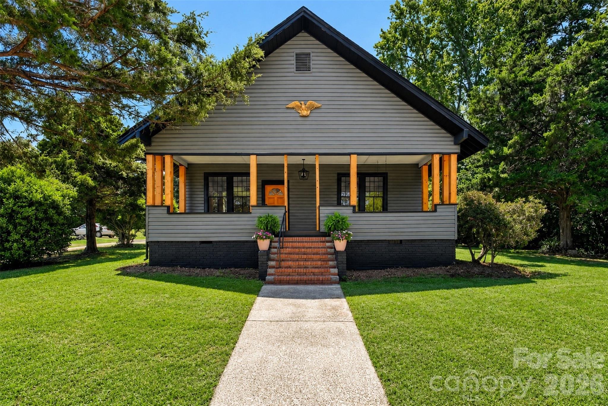 A stunning beauty brought back to life! With high ceilings and gorgeous 100 year old hardwoods, you will appreciate the character of this craftsman style home. Spacious rooms and thoughtful upgrades set the tone for the next owner. In addition to a new roof, the home has fresh paint inside and out. The old windows have been carefully preserved and repainted. Both bathrooms and kitchen have new cabinetry and granite counters. The kitchen has a Bosch double oven and new cooktop. There is a hidden wet bar/ pantry off the keeping room with a masonry wood burning fireplace. Spend afternoons on the front porch swing or line up your rocking chairs. The lot also has a 2 car carport in back and includes 1.7 acres of property. It's just a short walk to the Carolina Thread hiking trail, and the Catawba River kayaking route between the new white water center and the new SC state park to be completed next year, makes this an outdoor lovers dream location. Great Falls is also home to Carolina Adventure World, Rattlesnake Bike park, Canoe Blue Retreat and Rocky Creek sporting clays. Commuting time to Rock Hill/ Charlotte and Columbia are 25-45 minutes.