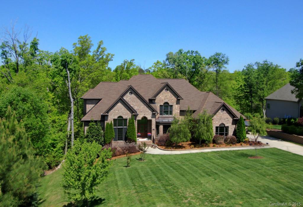 Exquisite custom waterfront home in a beautiful section of Lake Wylie! Open floor plan set up for entertaining, w/ an outdoor living area, lakeside firepit, views of a quiet cove. Covered dock with two boat lifts & two PWC lifts. Spacious kitchen with eat-in bar and island work area, wine bar, custom cabinetry. Main level master w/ elegant tray ceiling, his & hers closets, luxury bath. Lower level rec room, exercise rm, future media rm and lots of storage. Excellent Clover schools. See tour!
