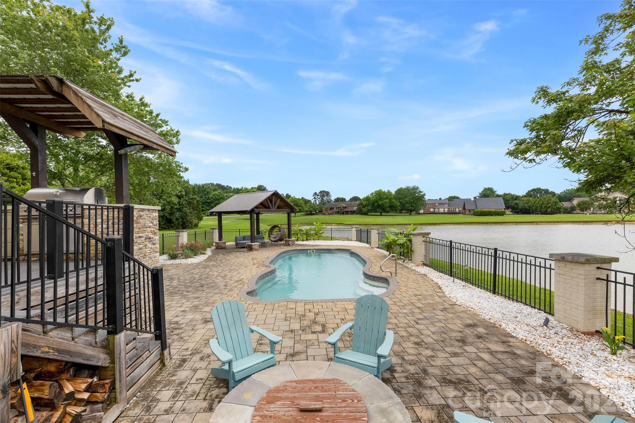 Rare 2.27-acre estate with pond views, saltwater pool, guest quarters, and assumable 2.75% VA loan.
Welcome to 231 Pennington Road, where everyday living feels connected to the outdoors. Situated on 2.27 acres overlooking a peaceful pond with year-round water views, this property offers a setting designed for gathering, relaxing, and creating lasting memories. 
The backyard retreat is built for enjoying every season, featuring a saltwater pool, oversized deck, two built-in fire pits, and an in-ground gas grill.  Creating multiple spaces to entertain or unwind. 
Inside, this full brick home offers approximately 3,997 total heated square feet with an open layout, kitchen island, study, sunroom, and multiple spaces designed for both everyday living and hosting guests. The main property includes 3,268 square feet, one and a half story, offering 3 bedrooms and 2 full / 2 half baths. 
A standout feature is the connected second living quarters with a separate entrance, kitchen facilities, and living space hosting 729 square feet with a full bedroom and bath.  Offering flexibility for a variety of living arrangements and uses. 
Additional features include detached garage parking, circular driveway, backup generator, fireplaces, and location within Silver Lakes with convenient access to surrounding amenities.