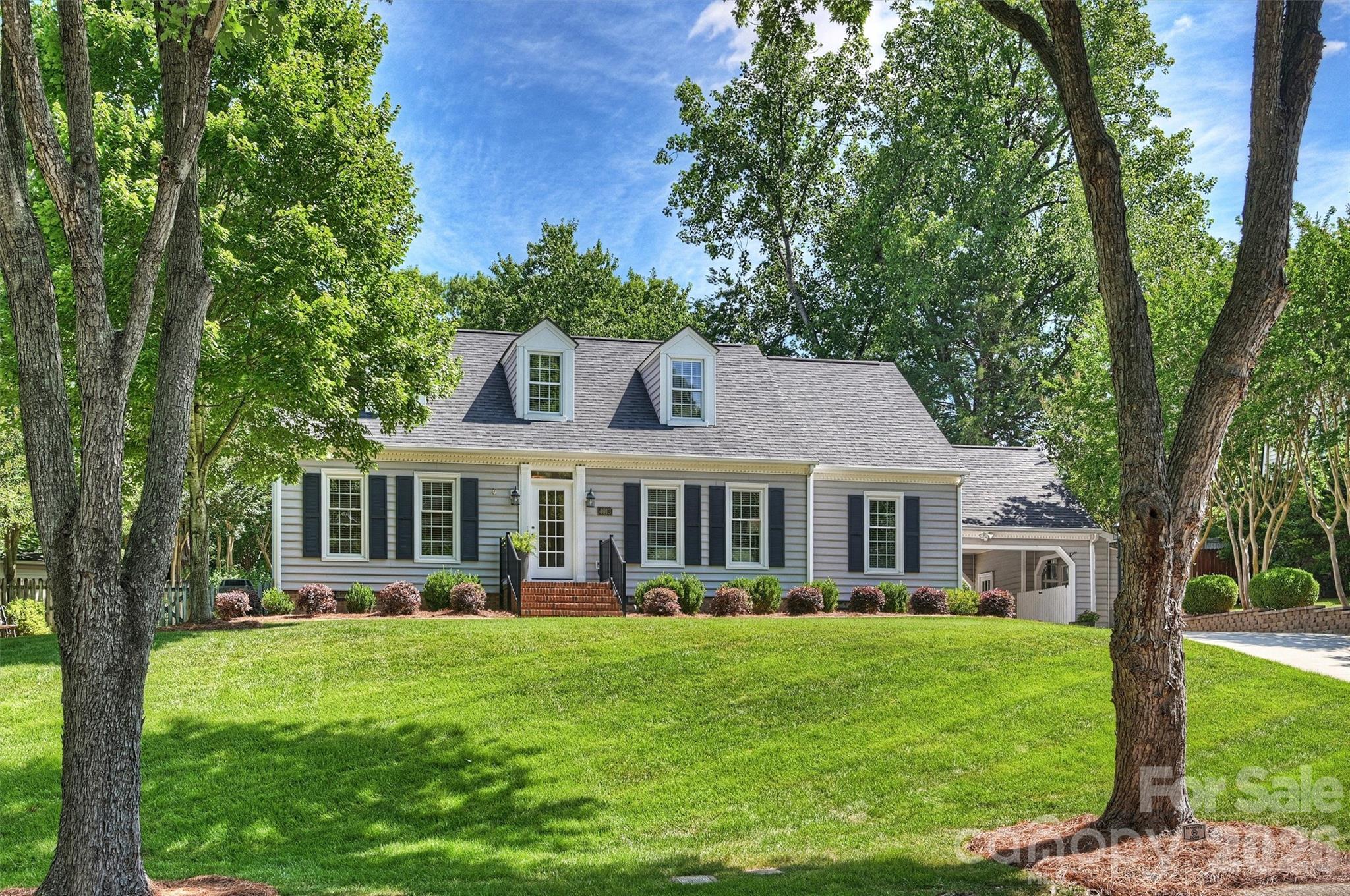 4013 Bridgewood Lane is a beautifully maintained home in Rockbridge--a favorite Charlotte neighborhood.  The home has great curb appeal and the landscaping around the pool and the backyard is beautiful.  With four Bedrooms and 2.5 Baths--this home has something for everyone.  Downstairs we have a Primary Bedroom and an additional Guest Bedroom.  There is also a recently renovated Kitchen--nice and bright with a great Breakfast Nook.  There is also a Dining Room, Living Room and Family Room with a gas fireplace.  The Screened Porch is right off the Kitchen and it connects to the Carport and a Woodworking area.  Upstairs there are 2 more Bedrooms as well as a Full Bath.  There is additional unheated square footage on the upper level that could easily be expanding to provide more living area.  There is also a deck off the back of the house. Whole house generator, refrigerator and washer and dryer convey.  NO CARPET--all of the floors are hardwood. The house is nice and neutral and move in ready.  The back yard pool is PERFECT, with beautiful landscaping and irrigation for our HOT Charlotte summers. The backyard is fully fenced.   4013 Bridgewood Lane is located close to SouthPark, Uptown and major shopping and dining.