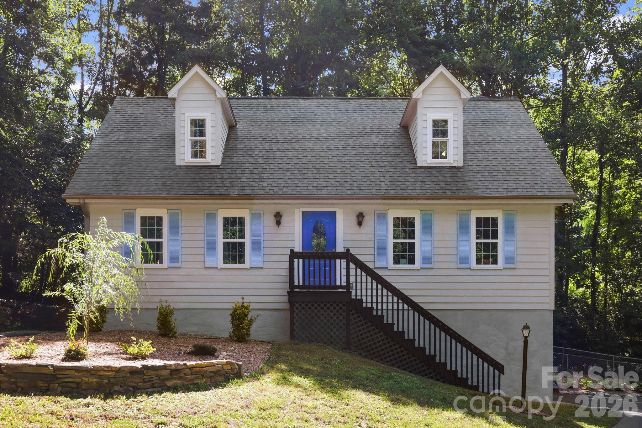 Nestled in the established and highly desirable Cinnamon Woods community, 209 Mint Way captures the essence of mountain living with its peaceful setting, mature surroundings, and inviting warmth. This beautifully renovated 3-bedroom, 2.5-bath home offers timeless character paired with modern comfort, featuring stunning 3/4-inch oak hardwood floors, inviting living spaces, and a peaceful setting you'll love coming home to.

One of the property's most unique features is the additional parcel included in the sale, providing endless possibilities—build a guest house, create a private retreat, expand your outdoor living space, or simply enjoy the added privacy and room to roam.

The finished basement offers flexible space perfect for a recreation room, home office, gym, media room, or guest area. Outside, relax on the peaceful back deck overlooking the fenced backyard, ideal for pets, play, gardening, or entertaining. A two-car garage provides additional storage and convenience.

Located in the heart of Flat Rock, you'll enjoy the tranquility of mountain living while remaining just minutes from shopping, dining, historic downtown Flat Rock, and all that Henderson County has to offer. A rare opportunity to own a move-in-ready home with extra land in one of the area's most established neighborhoods.
