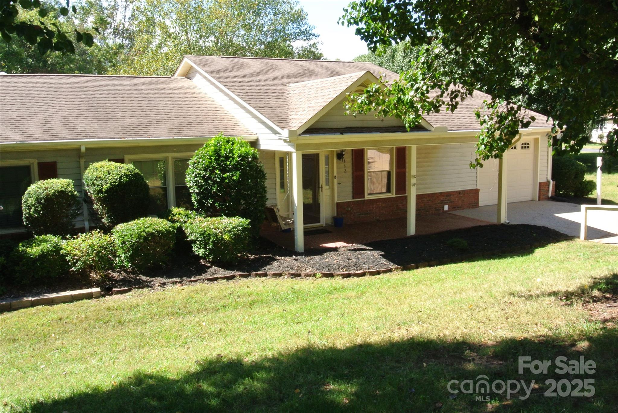 ENJOY THE COMFORT of one level living in a well established neighborhood, offering nice clubhouse, pool, social gatherings, weekly lawn maintenance, trash pickup and termite contracts for all units.  Plus more, included in the very affordable home owners association dues.  This warm & inviting home is nestled in mature hardwoods and has plenty of room for family & guests.  Great floor plan includes large living room, primary bedroom with full bath & walk in closet, 2nd bedroom with walk in closet, hall bath and sun room.  The well equipped kitchen with pantry & storage closet, opens to dining area.   Living room opens into the multi-use sun room that leads to the covered back patio overlooking the well manicured back lawn.  Oversized single car garage with pull down attic and very large storage closet complete this beautiful home.