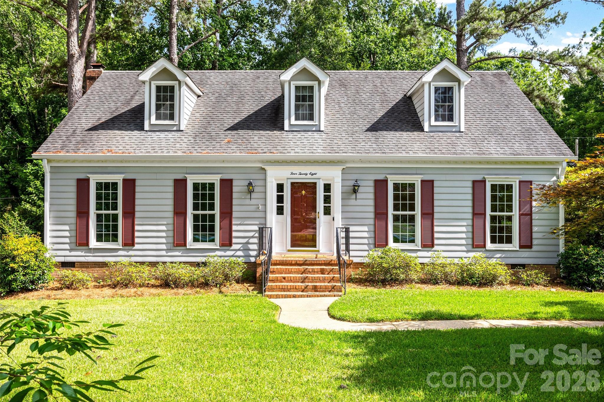 Welcome to your private retreat in the heart of the established Heathwood subdivision. Nestled on a generous 0.65-acre lot, this home offers classic charm and outdoor serenity, featuring mature landscaping with two signature bay trees and direct access to a peaceful creek in the backyard. Inside, the warmth of Appalachian hardwood floors leads you through a thoughtful layout, including a cozy den anchored by a gas fireplace and custom built-ins. The eat-in kitchen has a gas line already in place for those who prefer a gas range. Hosting is effortless with a formal dining room and the added convenience of a bedroom on the main level. The primary suite has beautiful views and dual closets for ample storage. Step outside to the impressive two-tier deck, perfect for entertaining within the security of a fully fenced backyard with creek access. With updated electrical, new carpet upstairs, freshly painted Sherwin Williams Alabaster White throughout and a 2-10 Home Warranty included, this home is as practical as it is beautiful.