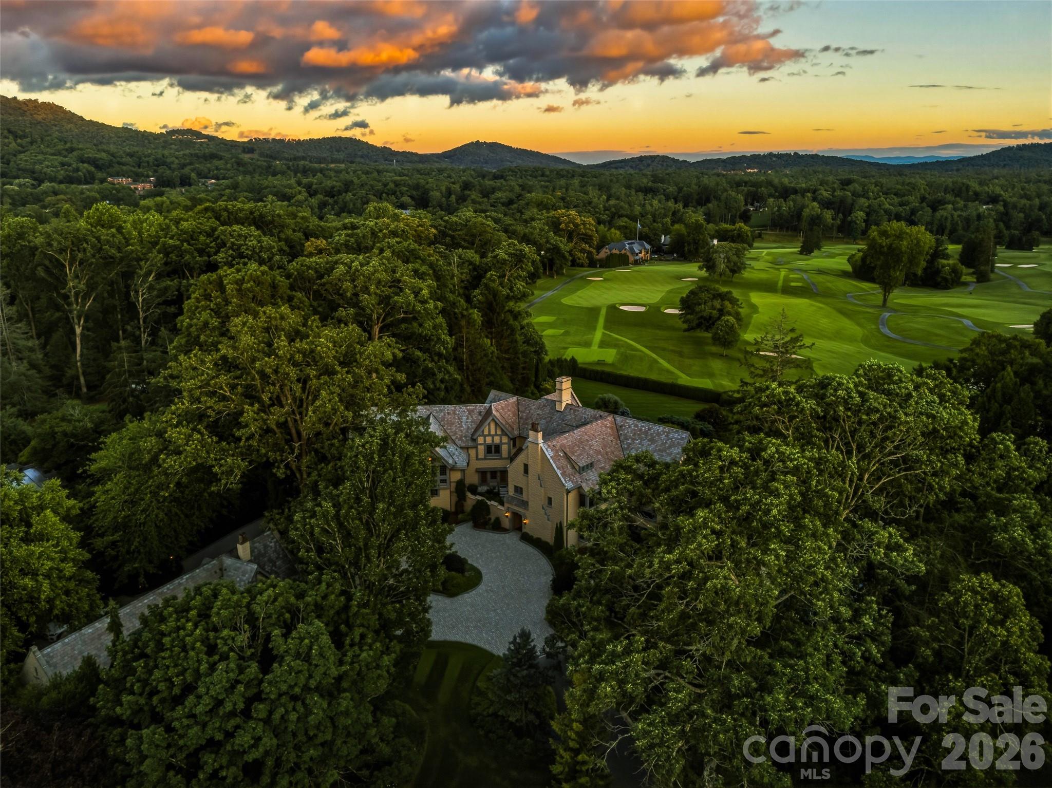 RARE, REFINED REMARKABLE. Your life unfolds inspired by a paradise of privacy, peace and perfection. Views of distant blue mountains are punctuated by the expansive fairways and greens of the fabled Biltmore Forest Country Club. Landscape worthy of a botanical garden envelops your life. This signature estate was designed by Richard Sharp Smith, supervising architect of the Biltmore House. Commissioned by Burnham S Colburn, who served on the Board of Edith Vanderbilt's Biltmore Company, he was a charter member of the Biltmore Forest Country Club and oversaw the nascent development of the Town of Biltmore Forest. One of the original three homes built in the Forest and sited on one of the prime lots. it was celebrated at the 100th anniversary of the Town and the Club. It is sited in the area known as the Golden Horsehoe, a reference to the horse shoe shaped area around the golf course populated by the early mansions of the Roaring 20s.    This century has brought an addition designed for open modern living including a spacious kitchen open to the vaulted family room, a screened view porch with built in grill, hardscape and landscape featuring a pool and spa,a pool recreation room with a kitchen and second billiards room or exercise room, croquet and bocci lawns, new computer controlled electric, plumbing, HVAC, slate roof on the main house, thermopane windows, remodeled baths, a theater room, a 100kw generator, lwells for landscape and an attached garage.  Blending the finest in modern living with the patina of history, this estate is for the discriminating buyer who demands a location and livability second ot none.   The Town of Biltmore Forest is located less than ten minutes from vibrant downtown Asheville and less than twenty minutes from the regional airport, Surrounded by fine dining and shopping it is bordered by the Blue Ridge Parkway and hosts a part of the Mountain to Sea Trail.  It has its own police force, a private Country Club and pre k to 12th grade day school and medical offices.   Carved from the Biltmore Estate in 1922 the Town offers many opportunities to its residents for recreation and socialization.Its peaceful serpentine roads lead past streams to parks and a bass pond. It is a haven for walkers and bikers.  Enjoy the finest of mountain living.