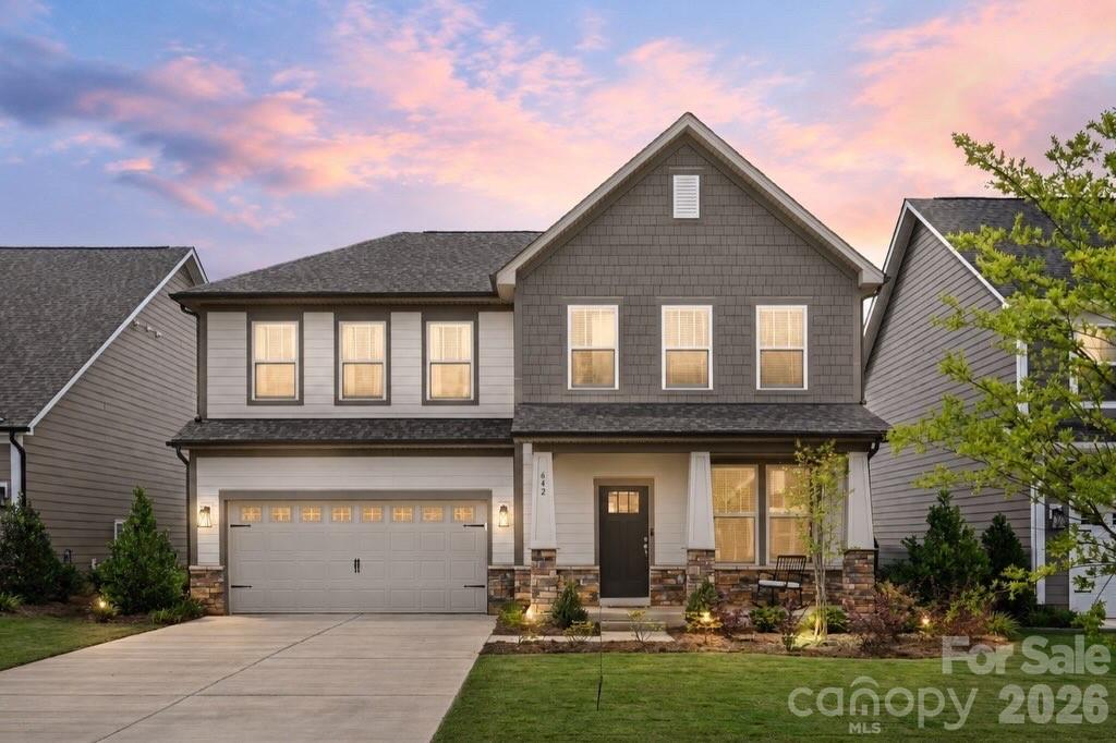 Introducing a stunning, newly completed 4 bedroom/3 bath residence that effortlessly blends contemporary design with everyday functionality — all without the wait of new construction! Completed in 2025, this light-filled home welcomes you with a covered front porch and a beautifully appointed open-concept main level, where rich LVP flooring and thoughtfully curated finishes create a warm yet modern aesthetic.

At the heart of the home, the chef’s kitchen is both stylish and highly functional, featuring granite countertops, a striking herringbone backsplash, an expansive island and a generous pantry. Designed for seamless entertaining, the kitchen flows effortlessly into the dining area and living room, while offering direct access to a spacious covered patio, perfect for elevated indoor-outdoor living with room for both lounging and dining.

The main level also offers a well-appointed guest bedroom and full bath, ideal for visitors or multi-generational living. Upstairs, the primary suite serves as a private retreat, highlighted by elegant tray ceilings, a spa-inspired en-suite bath and a large walk-in closet. Two additional bedrooms, a full bath, a generously sized laundry room with built-in storage and sink, and a versatile loft space complete the upper level, offering flexibility to suit a variety of lifestyles.

Perfectly positioned to enjoy the charm of historic York and the lifestyle of Lake Wylie, this home is just moments from Allison Creek Park — a 160-acre waterfront destination featuring boat ramps, walking trails, a fishing dock, playground, picnic areas, and so much more. With convenient proximity to Highway 49 and nearby shopping and dining at the Rivergate Sopping Center and Lake Wylie Plaza, this exceptional home offers a rare combination of modern comfort, thoughtful design and an unbeatable location!