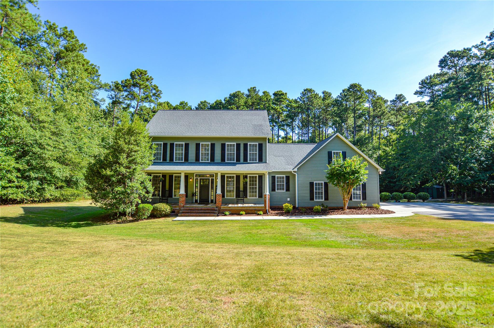 Experience serene country living with this beautifully maintained 4-bedroom, 3-bath home, perfectly situated on 5 peaceful acres. Every window frames a view of the surrounding trees, creating a private, nature-filled retreat. Step inside to find a spacious layout with a bonus room, many built-ins, and custom cabinetry throughout. The stunning kitchen features newer appliances and plenty of workspace for the home chef. The inviting living room boasts a gas fireplace with a full chimney for a wood-burning option—perfect for cozy evenings. Additional highlights include a convenient laundry chute, concrete driveway, and a 2-car attached garage. You’ll also appreciate the comfort of a newer HVAC system for year-round efficiency. Enjoy your mornings or evenings on the screened-in back porch——while listening to the sounds of nature. Whether hosting friends, relaxing with family, or simply soaking in the wooded views, this property blends comfort, quality, and tranquility all in one.