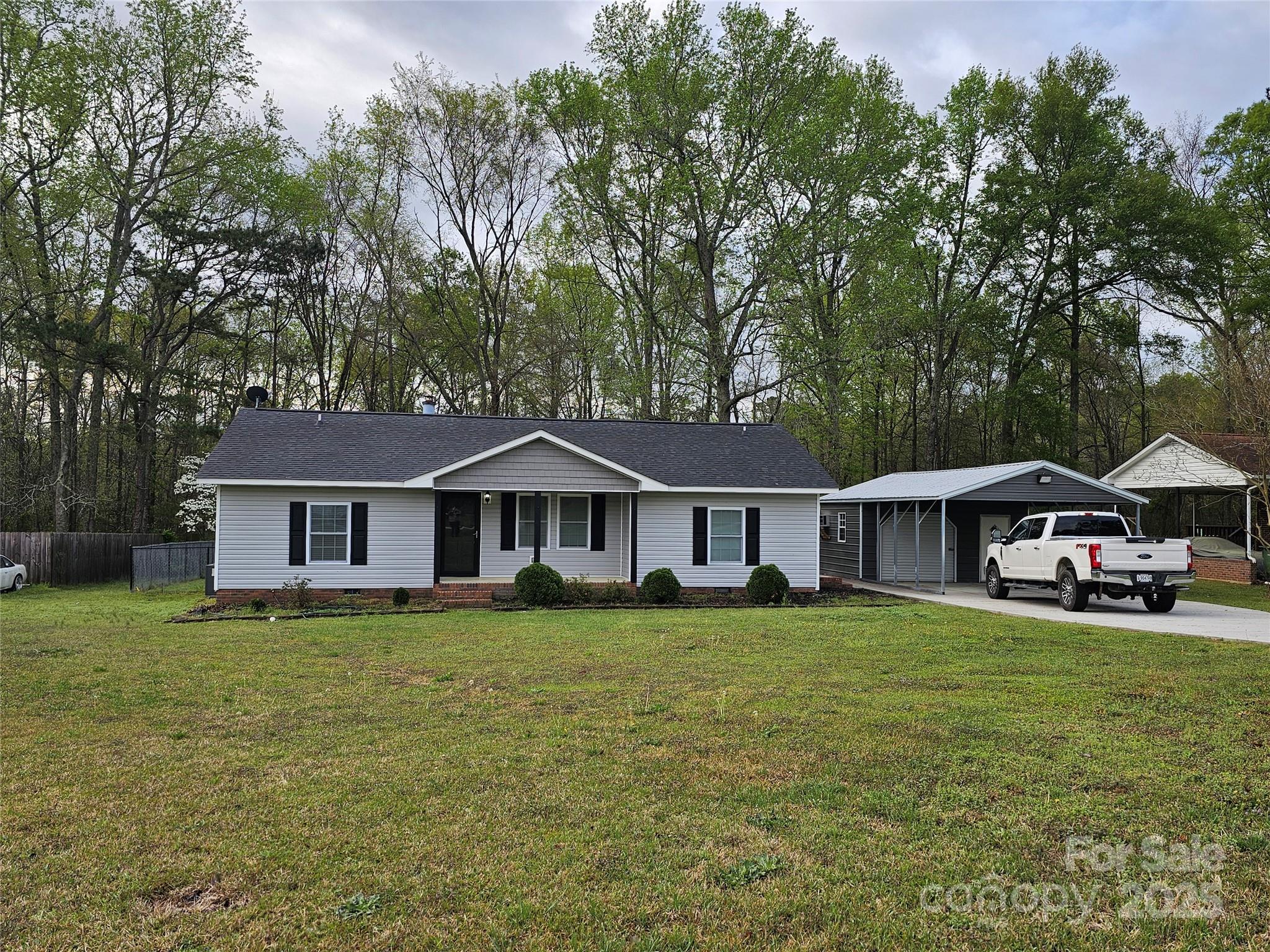 Home is back on the market at no fault of the Seller.  So, here's your chance to come and enjoy all this home has to offer.  Split floor plan, home has 3 bedroom, 2 full baths. Large living room with fireplace, dining area, sliding glass doors that lead to a screen porch. Fenced back yard. Storage building in back yard and also large storage building at side that's wired and have HVAC window unity.
